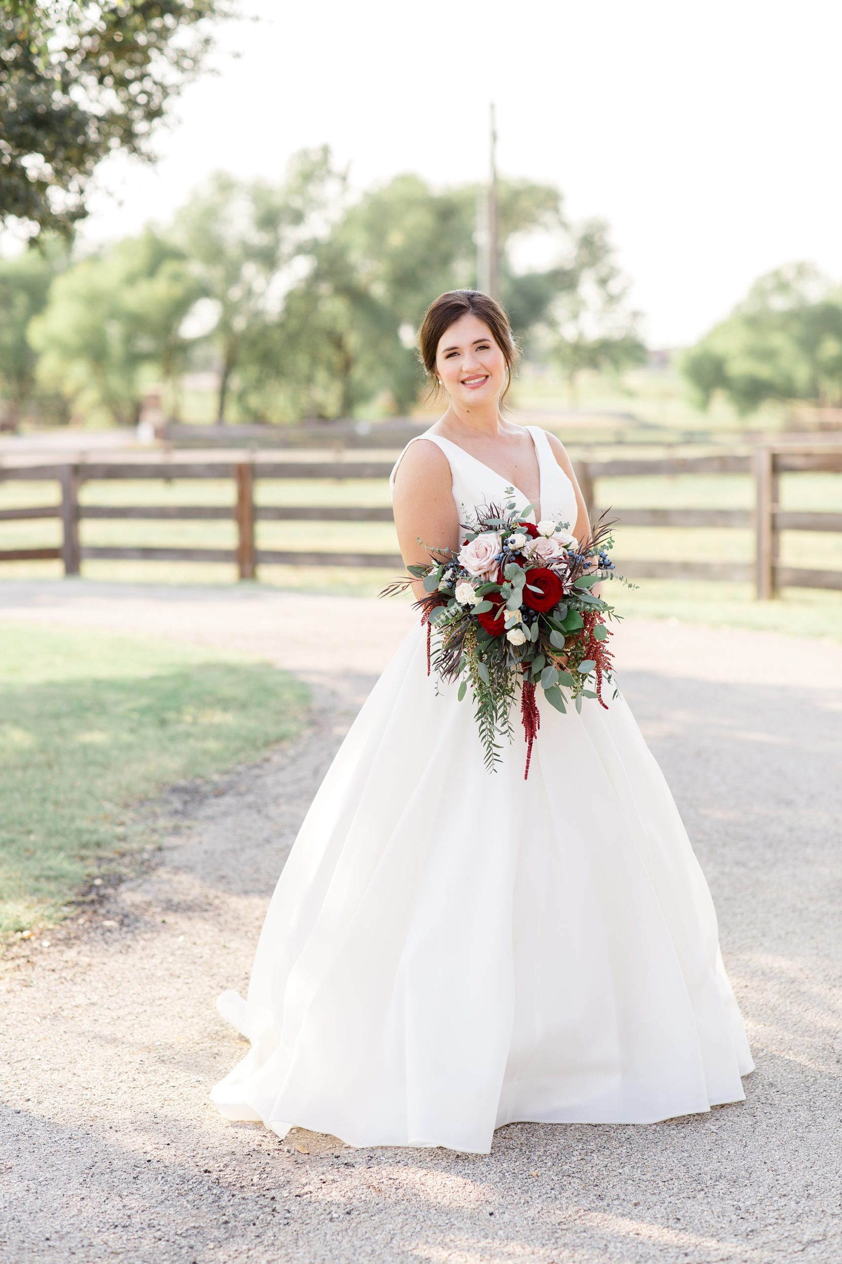 bridal portraits on driveway at private ranch in Argyle TX