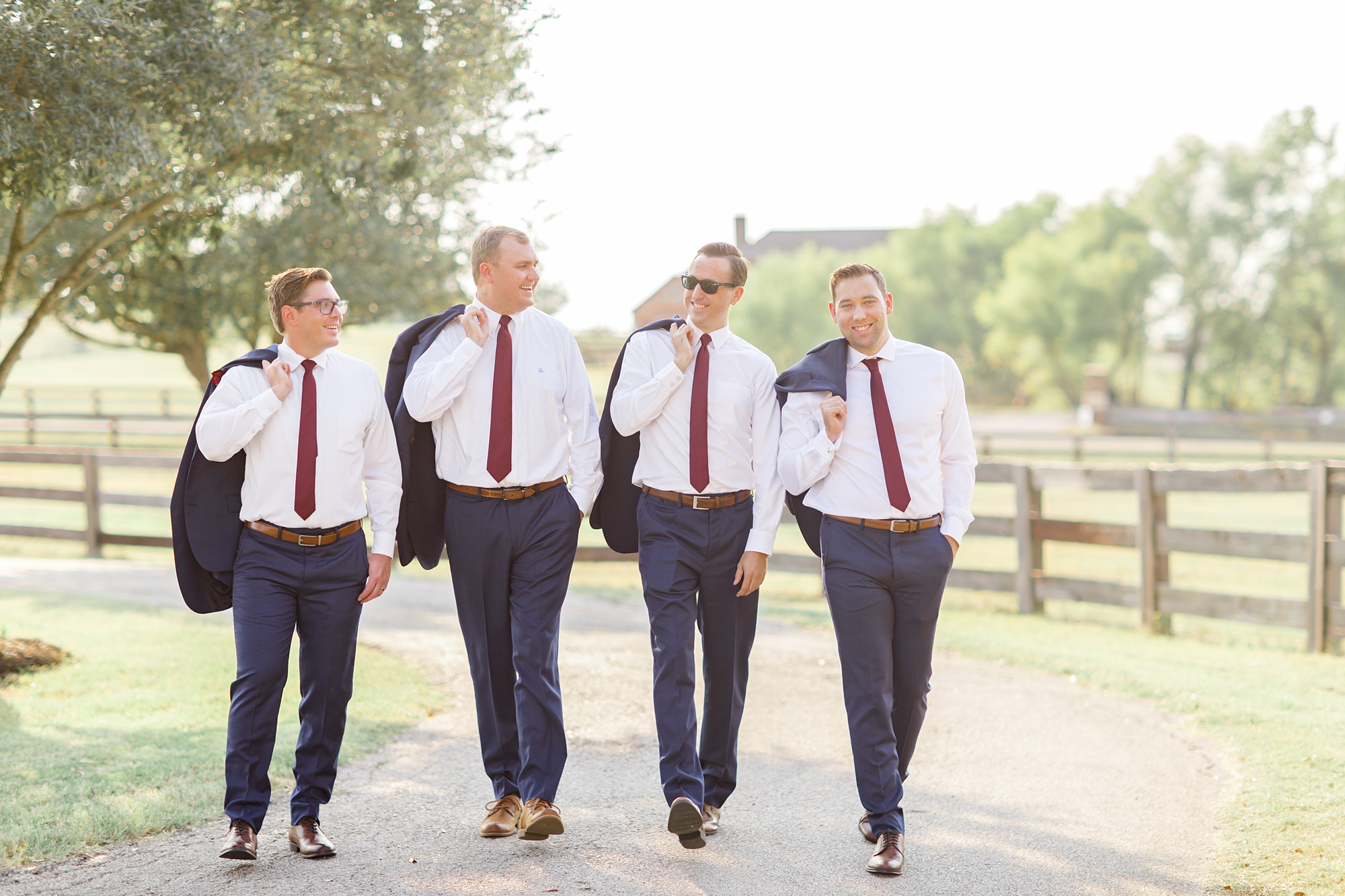 groomsmen walk through ranch in Argyle TX