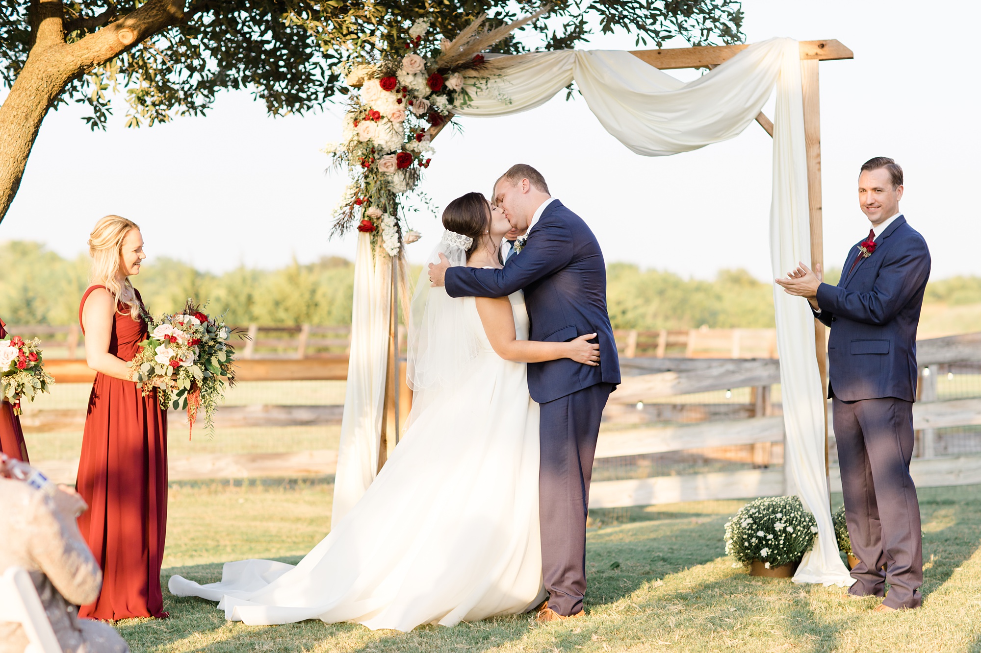 newlyweds kiss during Texas wedding ceremony