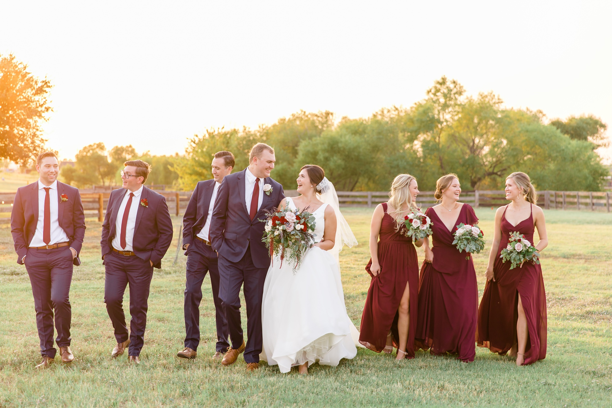 wedding party walks through field at private ranch in Argyle TX