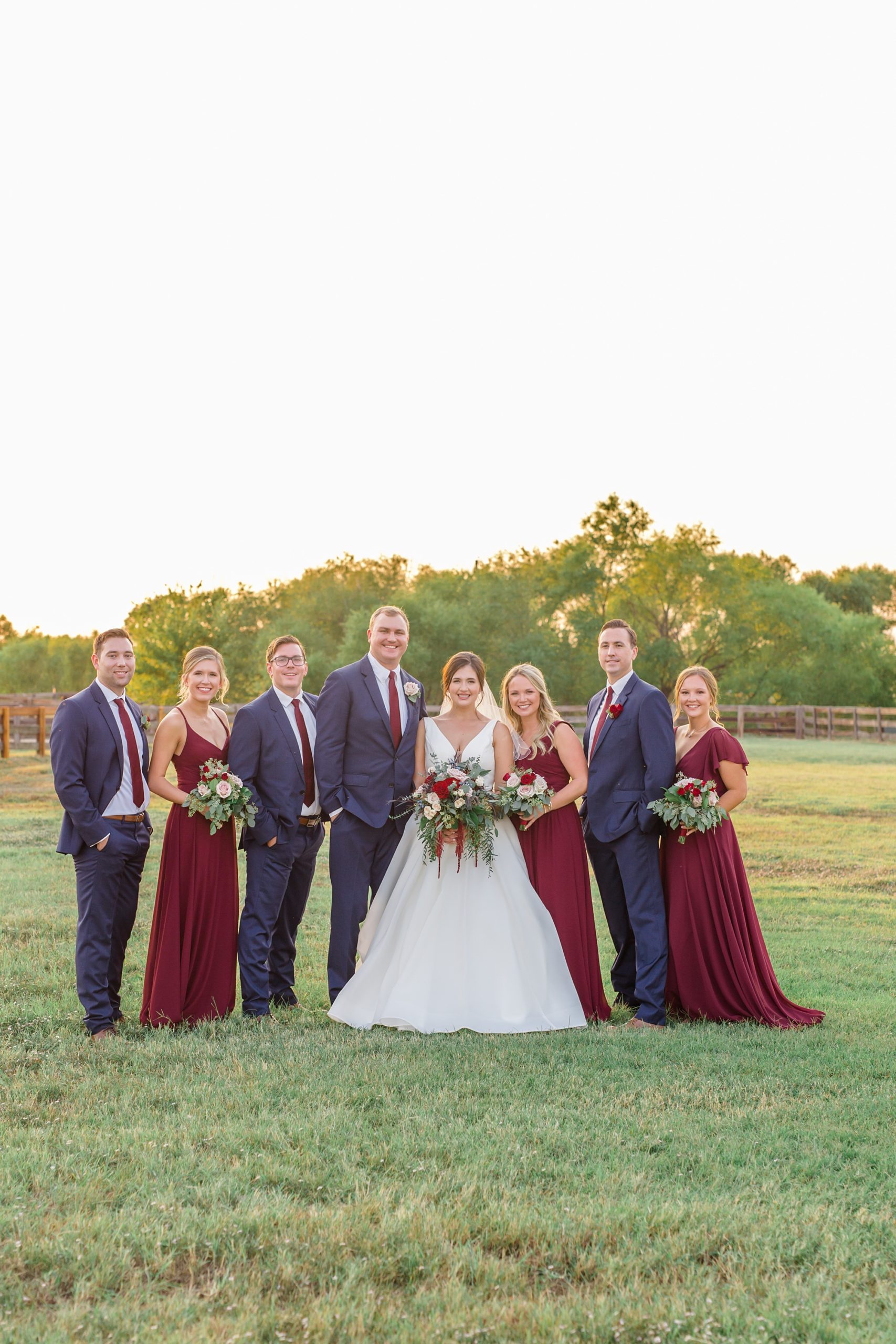 Texas wedding party poses at sunset in Argyle TX