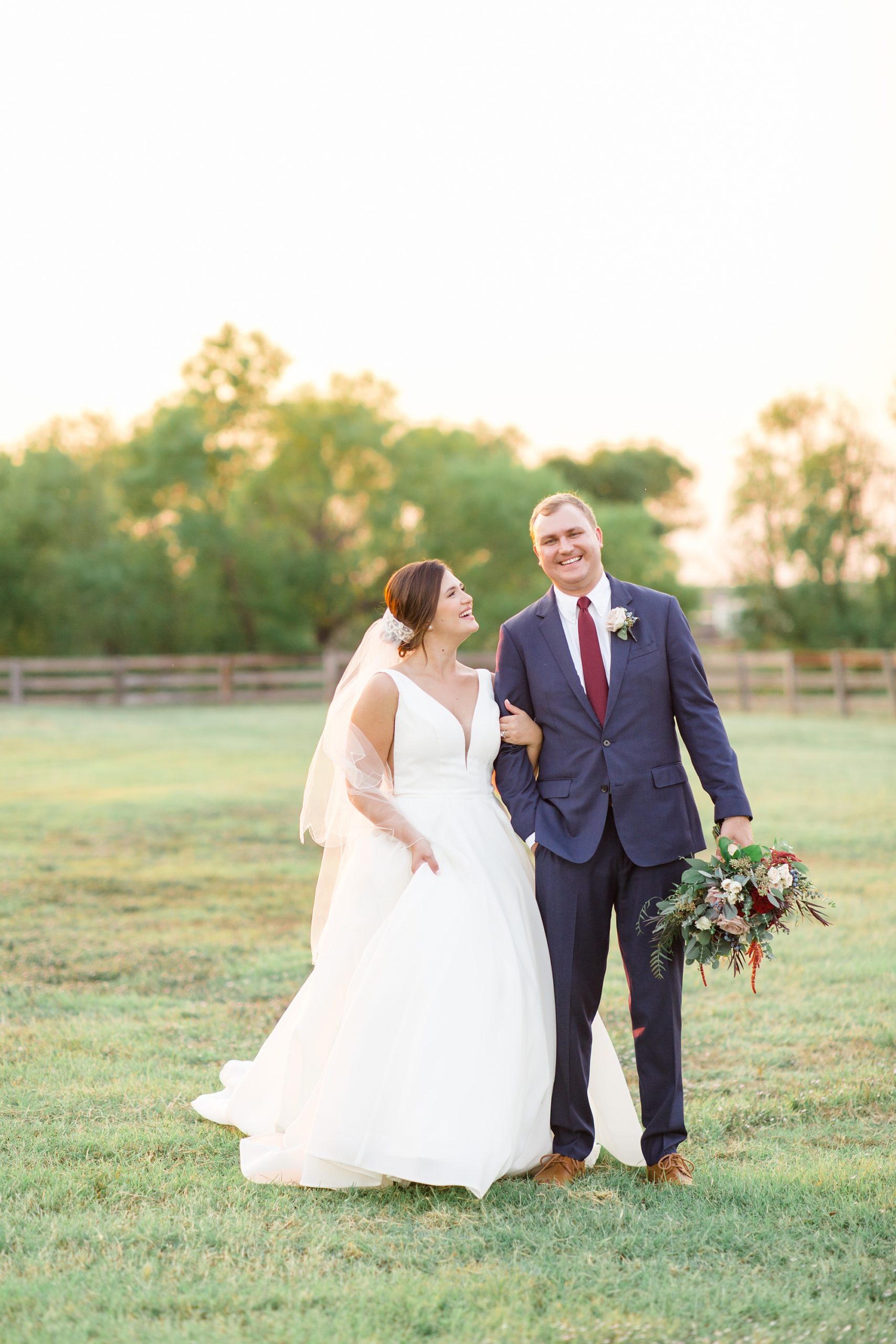 bride and groom walk through private ranch in Argyle TX