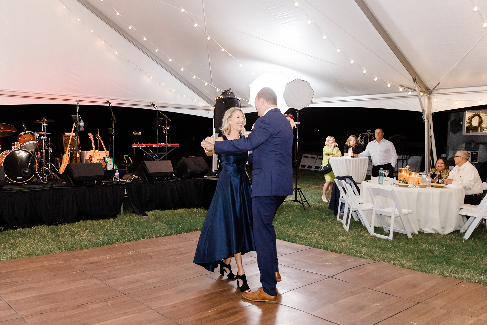 son and groom dance during Argyle TX wedding reception