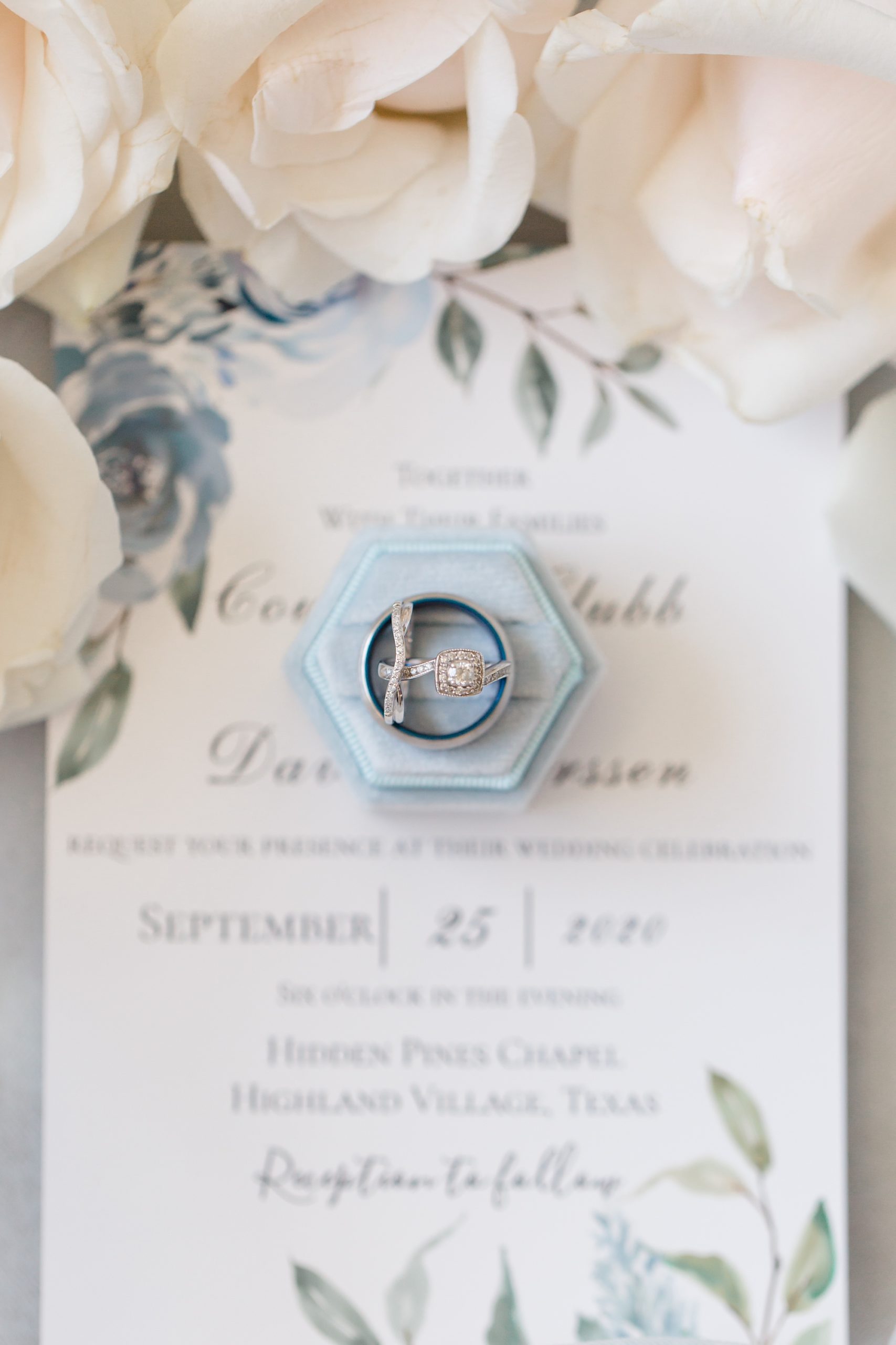 bride's ring sits in blue box
