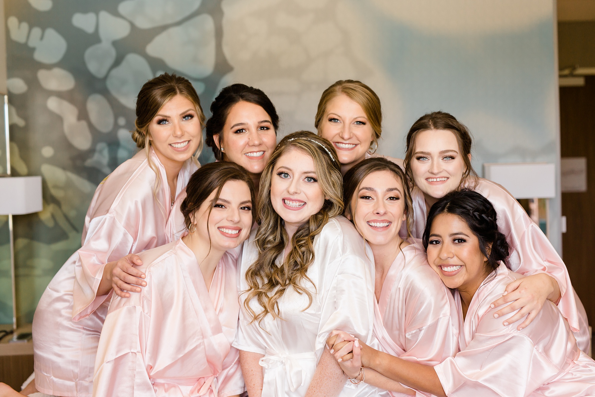 bride and bridesmaids group together before TX wedding