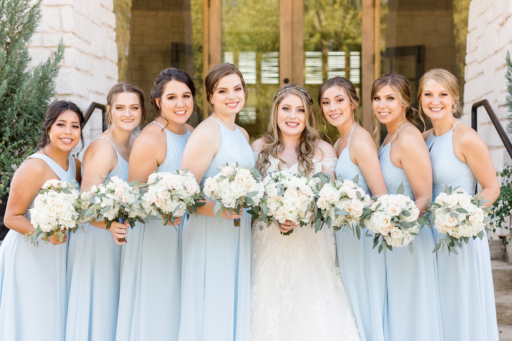 bride and bridesmaids in sky blue dresses 
