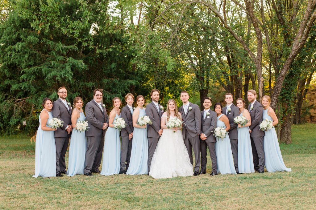 Texas wedding party poses with bride and groom