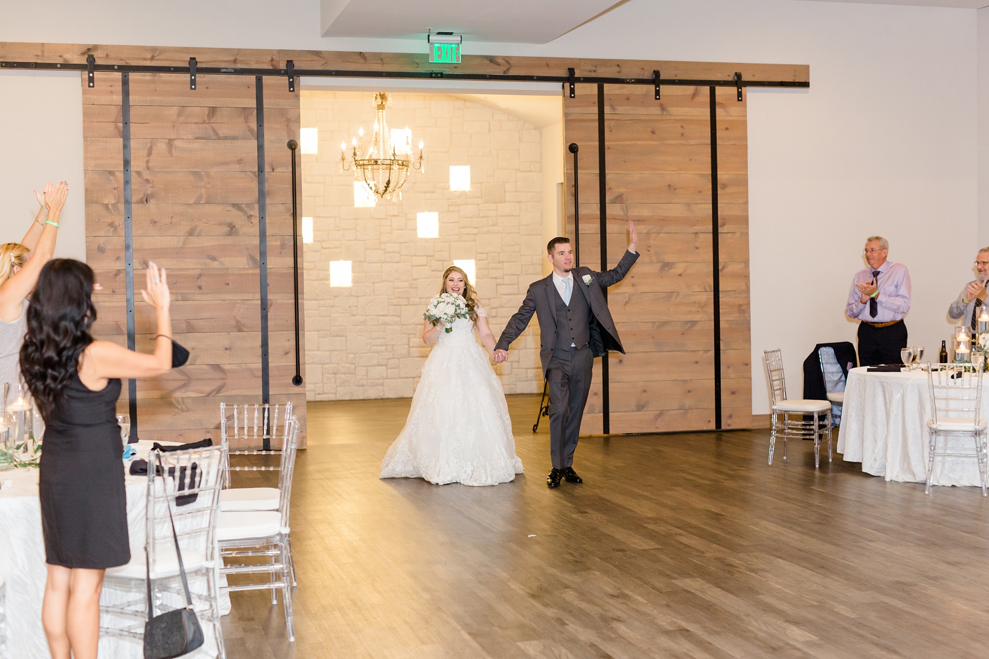 bride and groom walk into Dallas wedding reception