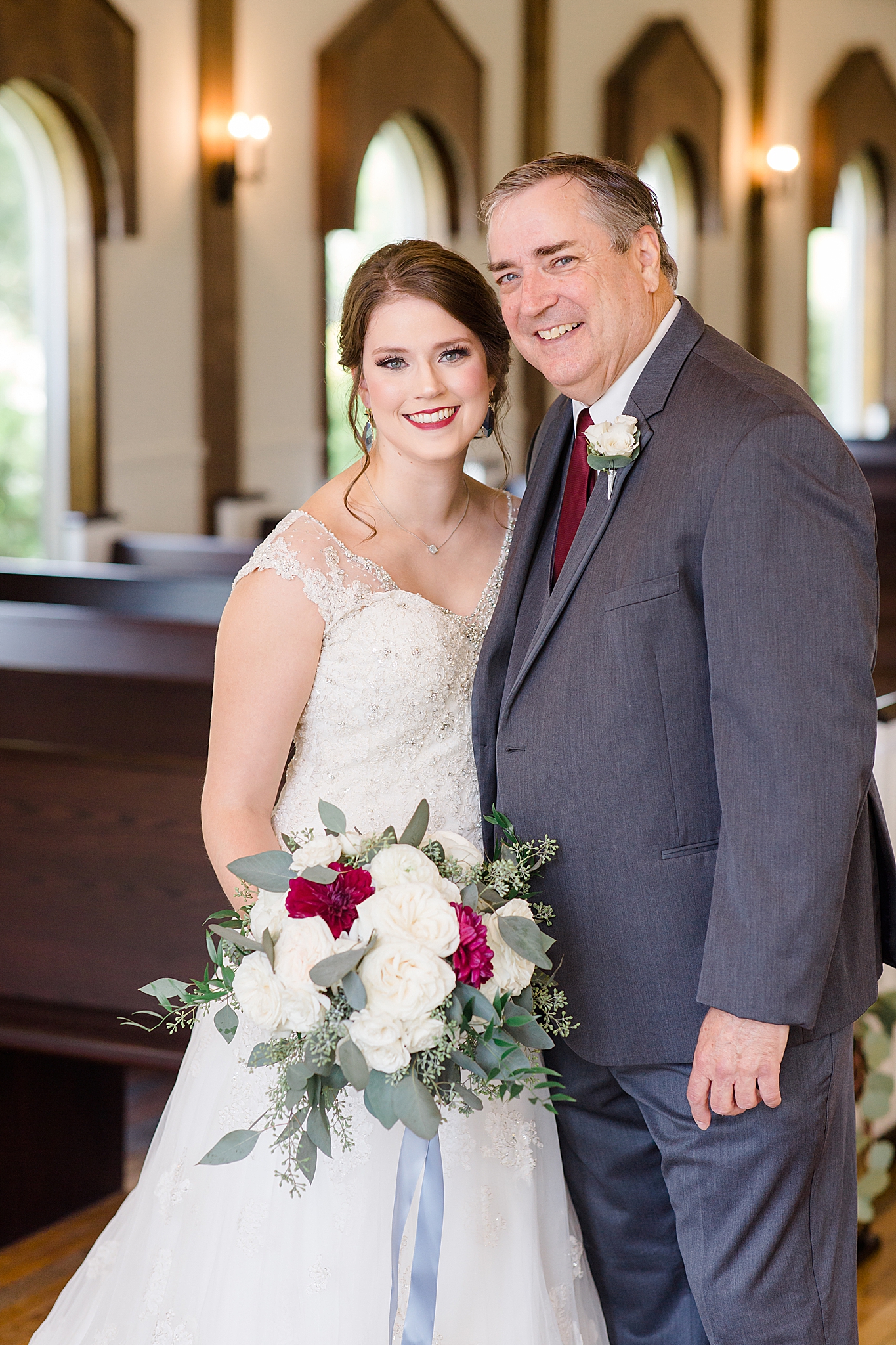 bride and father pose after first look before Rustic Grace Estate wedding
