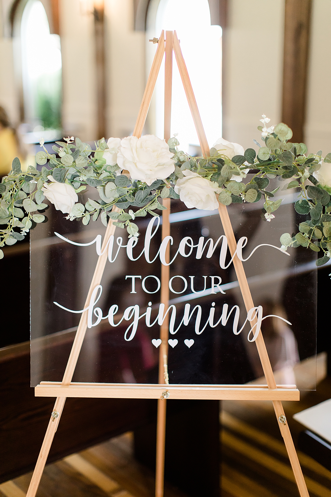 sign to welcome guests to wedding ceremony