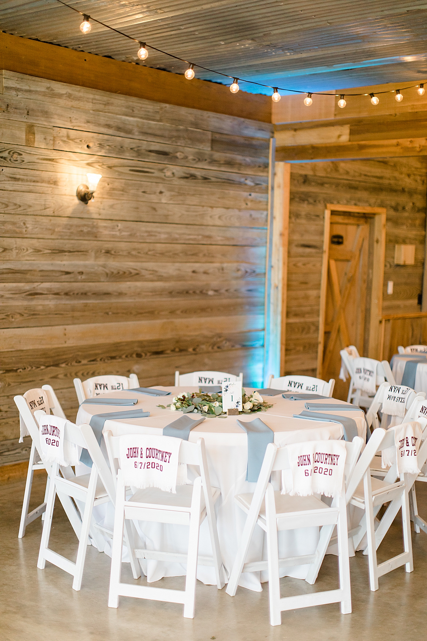 tables with blue napkins and towel favors for Rustic Grace Estate wedding