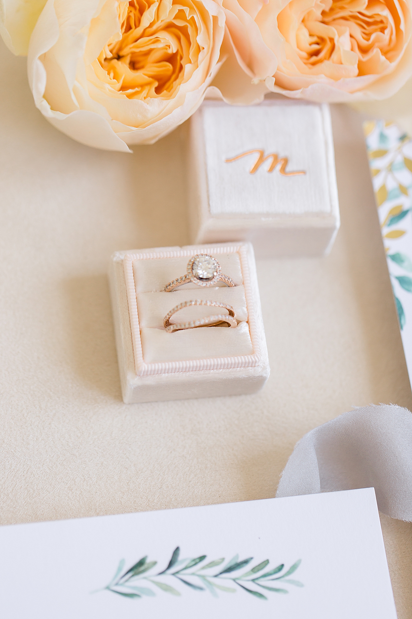 bride's engagement ring in tan box