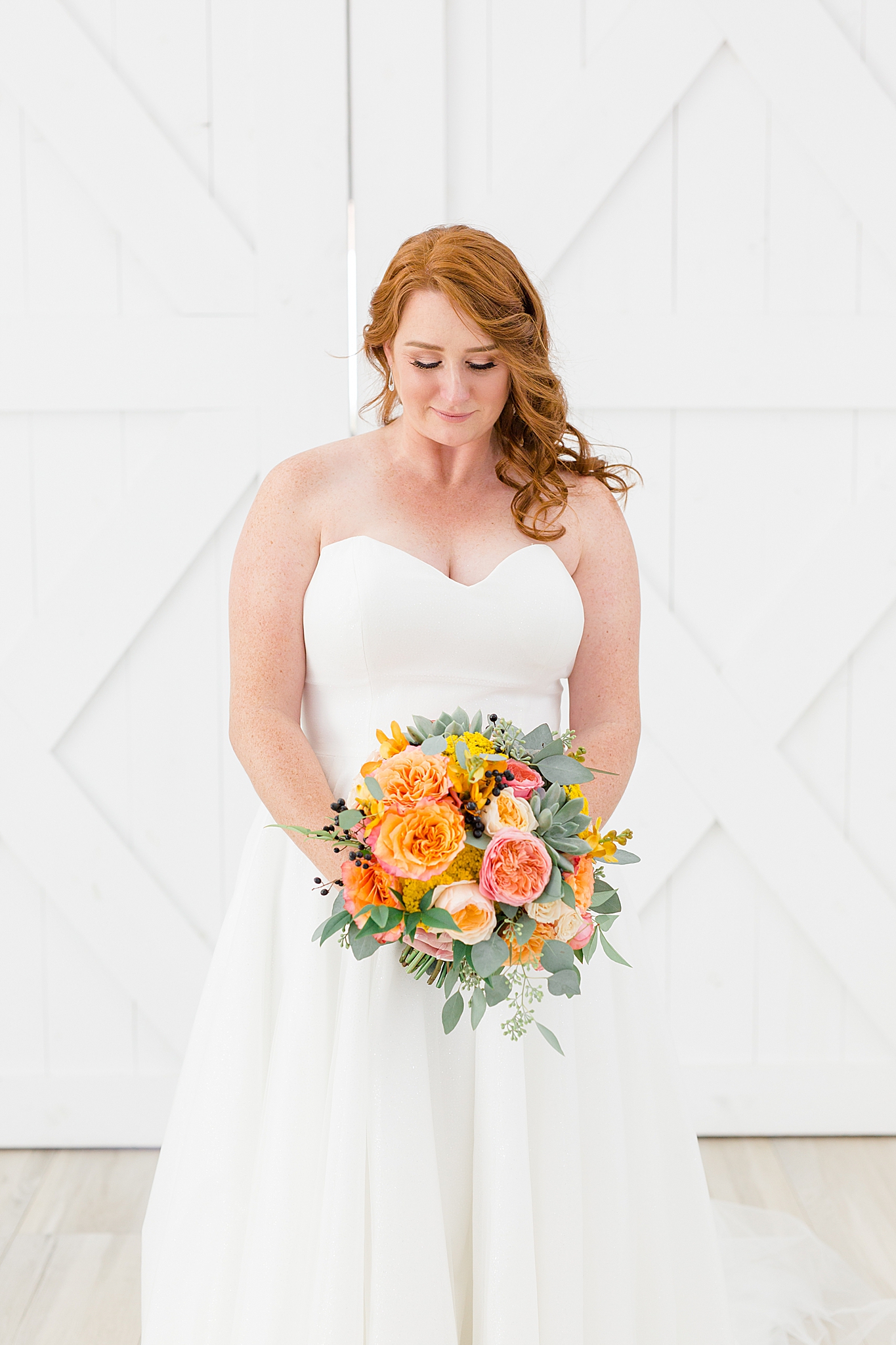 bridal portrait by barn doors at The Nest at Ruth Farms