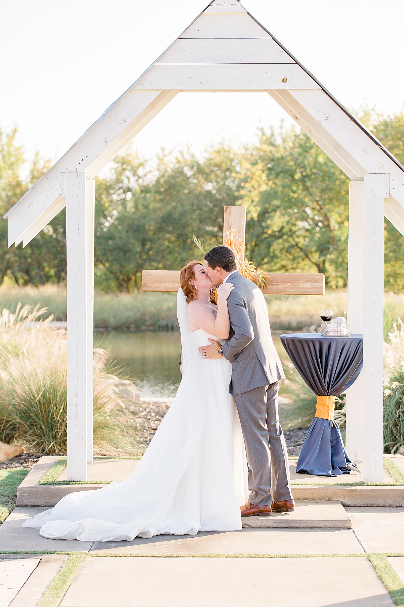 newlyweds kiss at The Nest at Ruth Farms