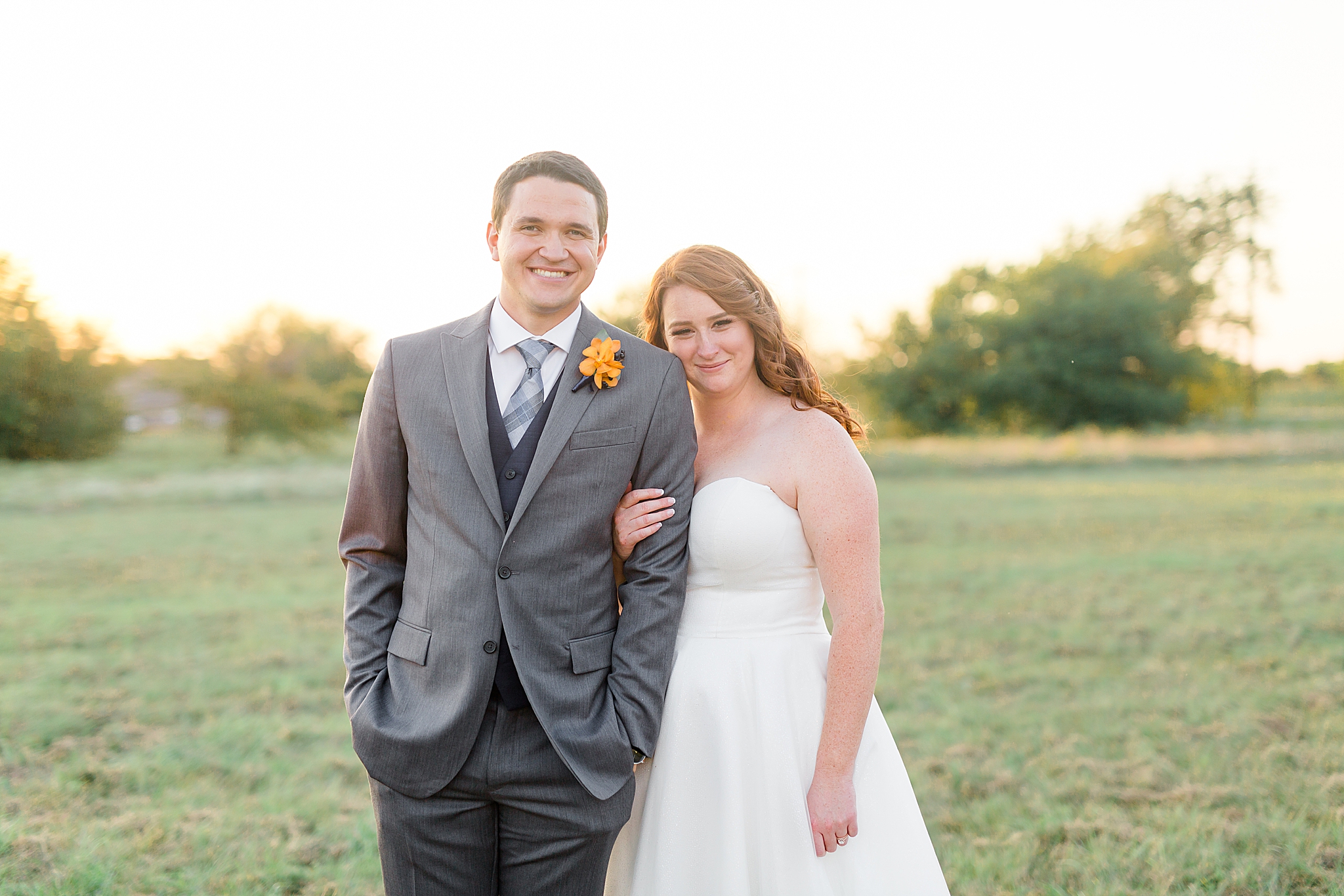 bride leans on groom's shoulders during sunset The Nest at Ruth Farms portraits