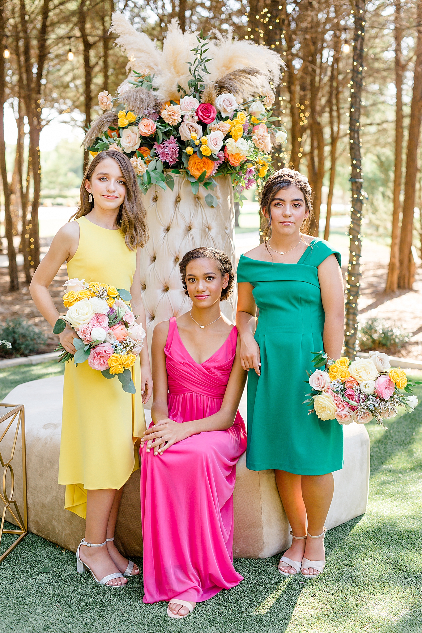 three Jr. bridesmaids in bright dresses pose in Texas