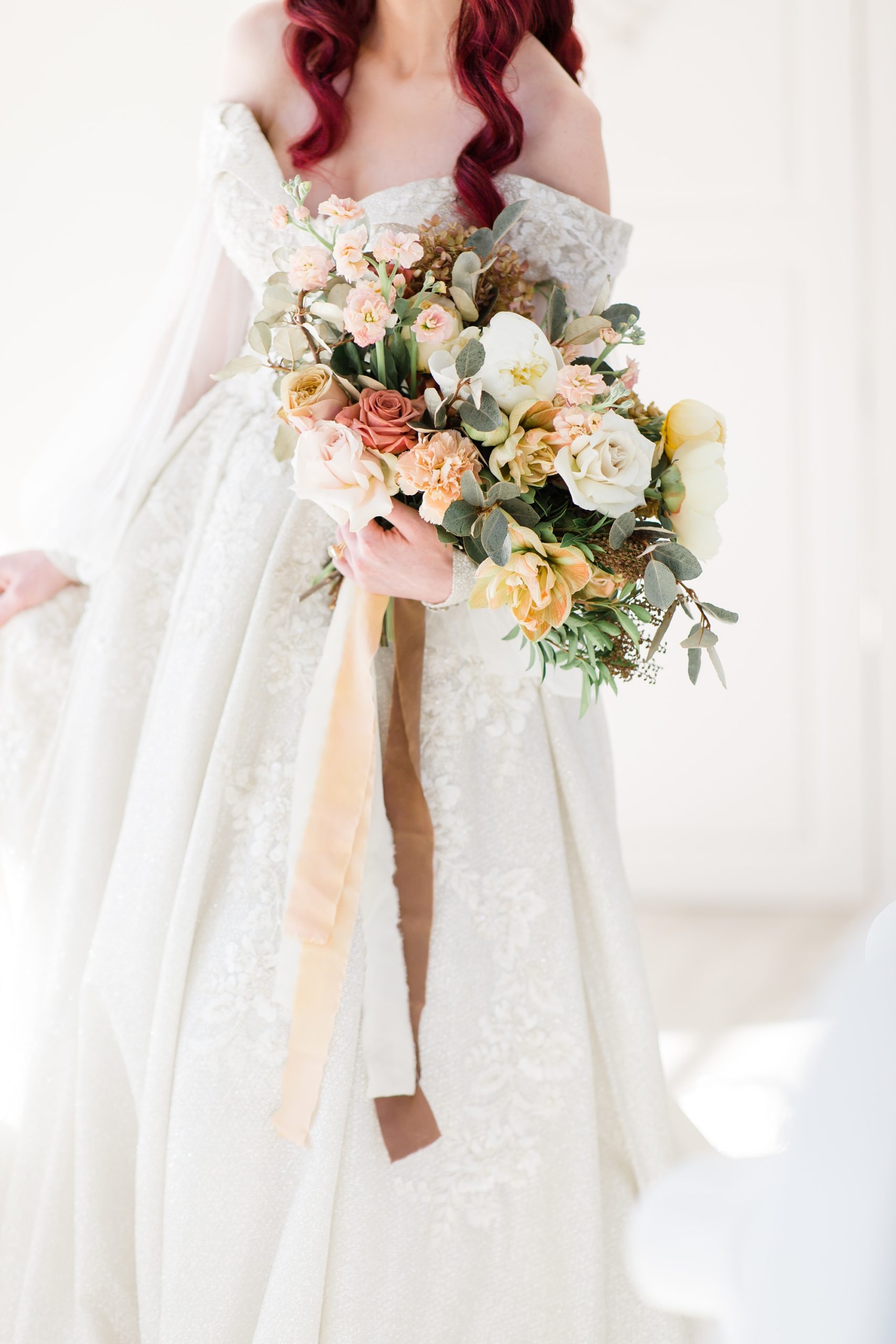 bride holds modern wedding bouquet for spring shoot