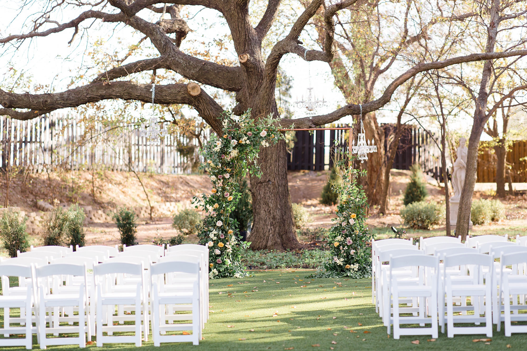 arbor with greenery for outdoor ceremony at Brighton Abbey