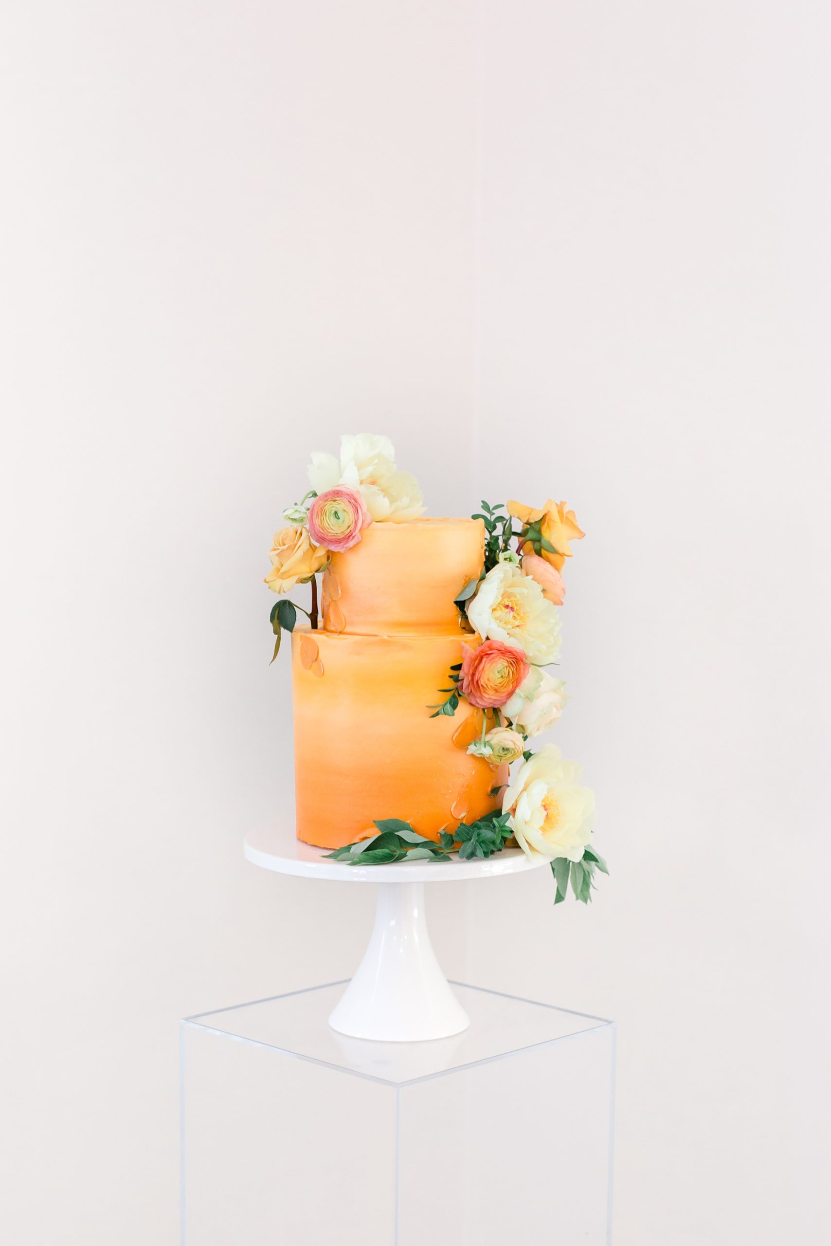 tiered wedding cake with citrus details