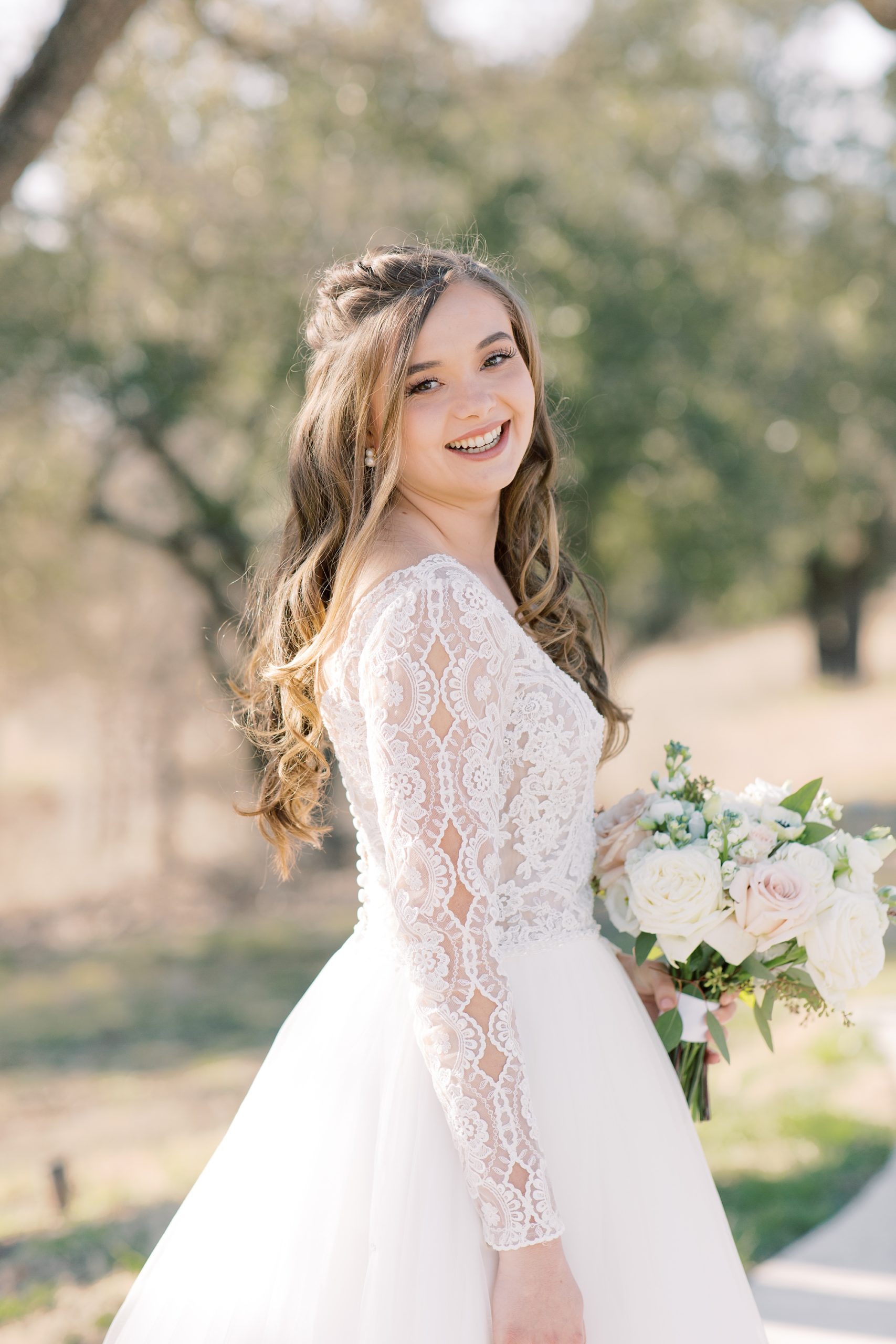 bridal portrait of bride wearing lace sleeved gown at HighPointe Estate