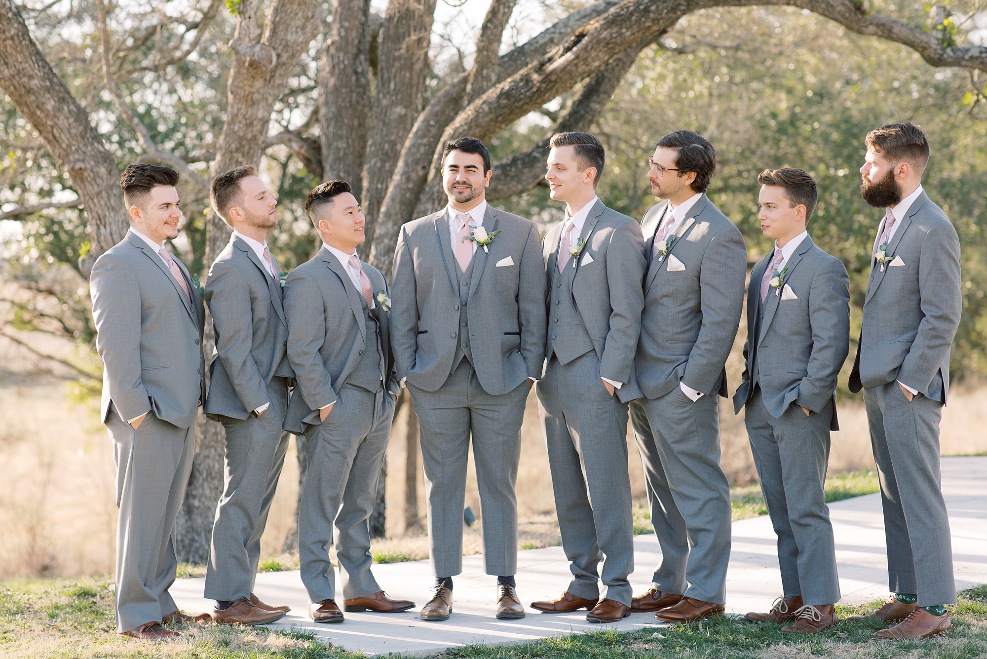 groom poses with groomsmen at HighPointe Estate