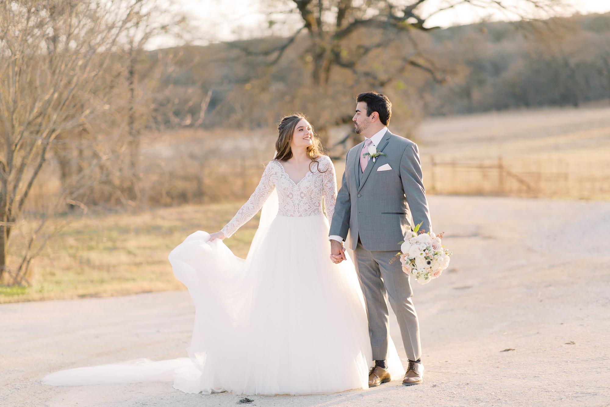 bride and groom walk along path at HighPointe Estate