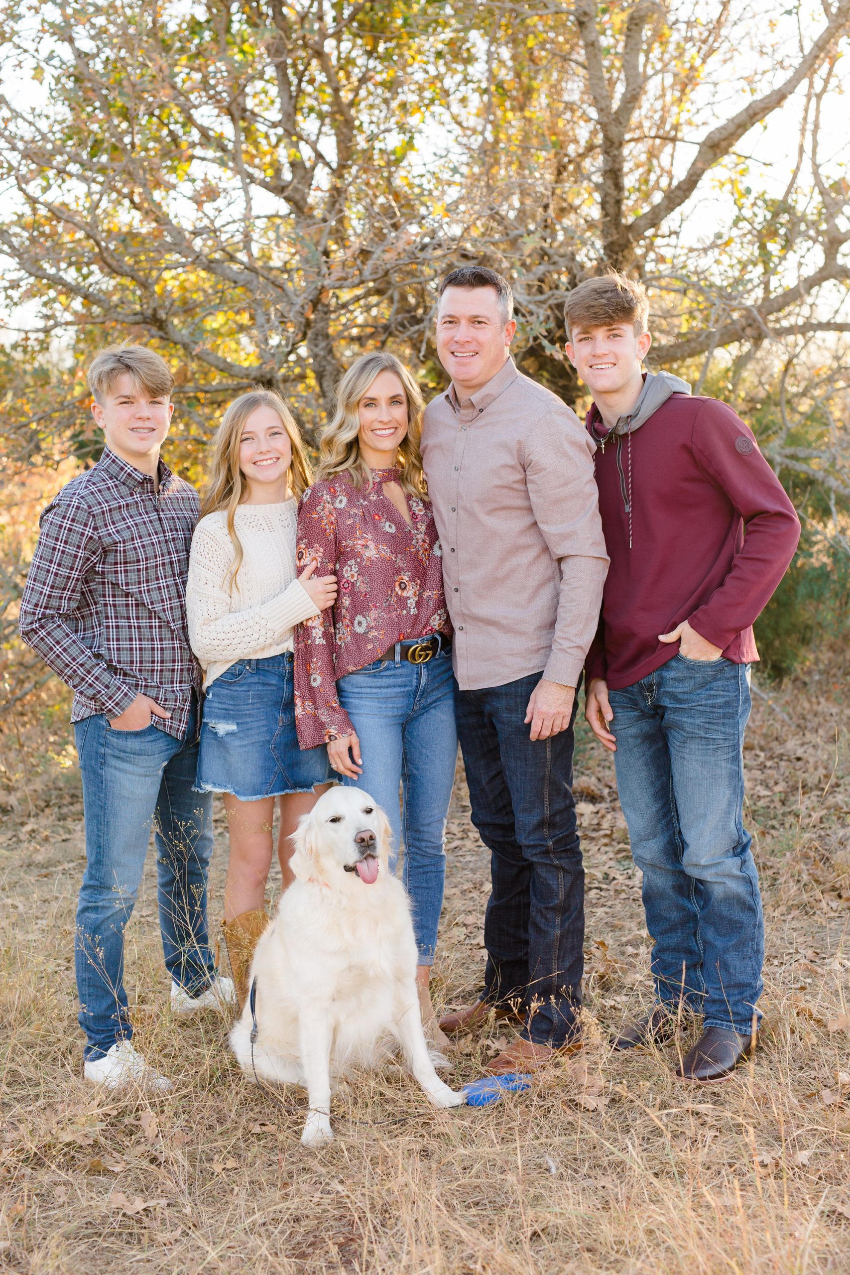 family of five poses with dog during fall Murrell Park family session