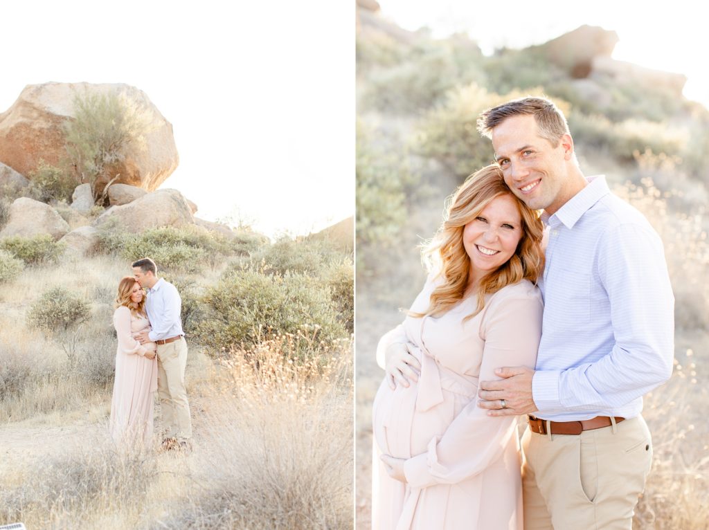 husband and wife walk through desert during Scottsdale AZ maternity session