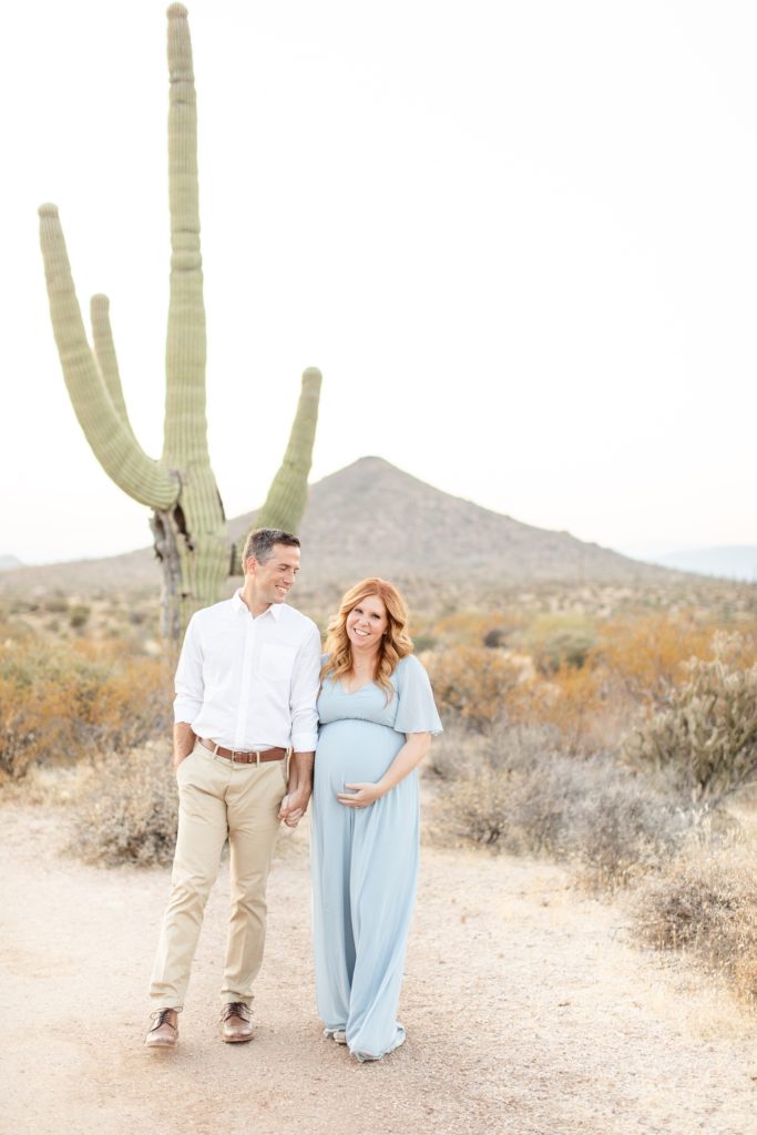 couple poses by cactus photographed by Amy & Jordan Photography 