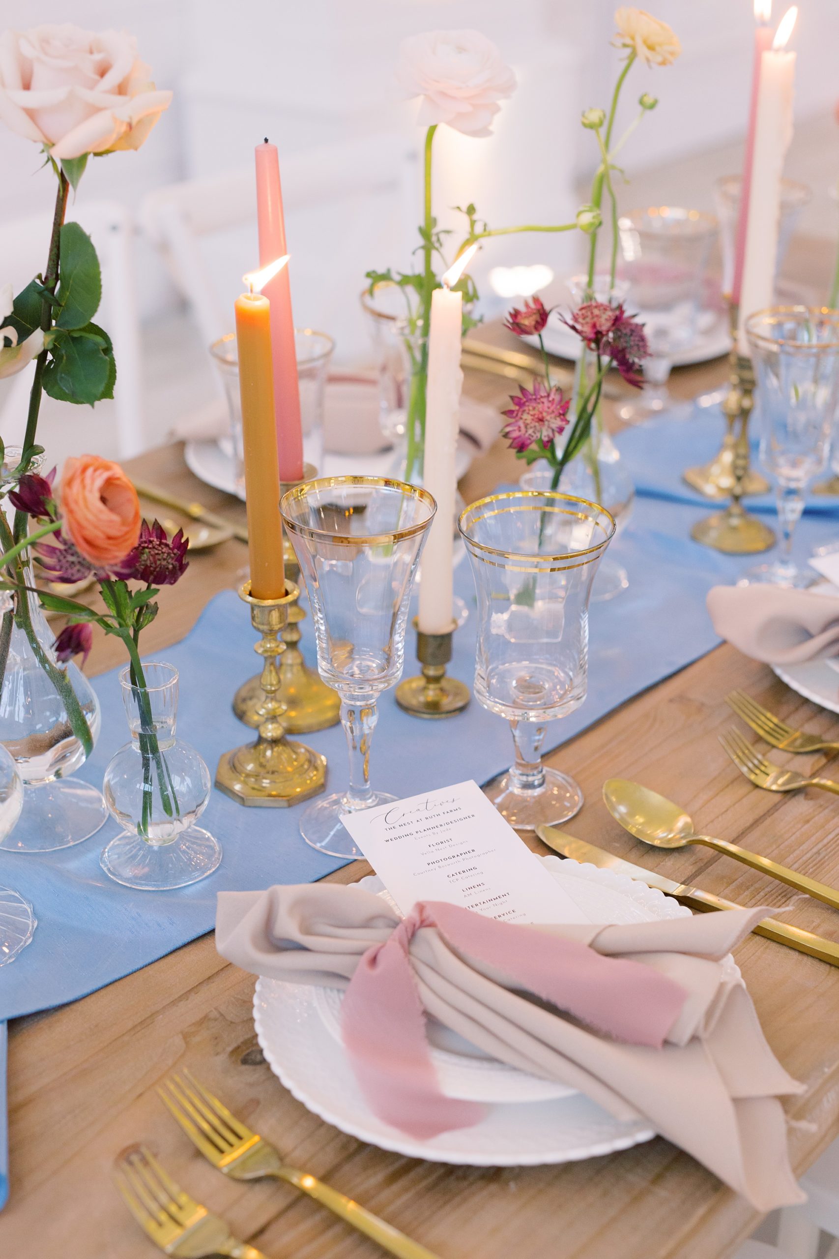 romantic wedding reception inspiration with pale blue table runner and pink napkins