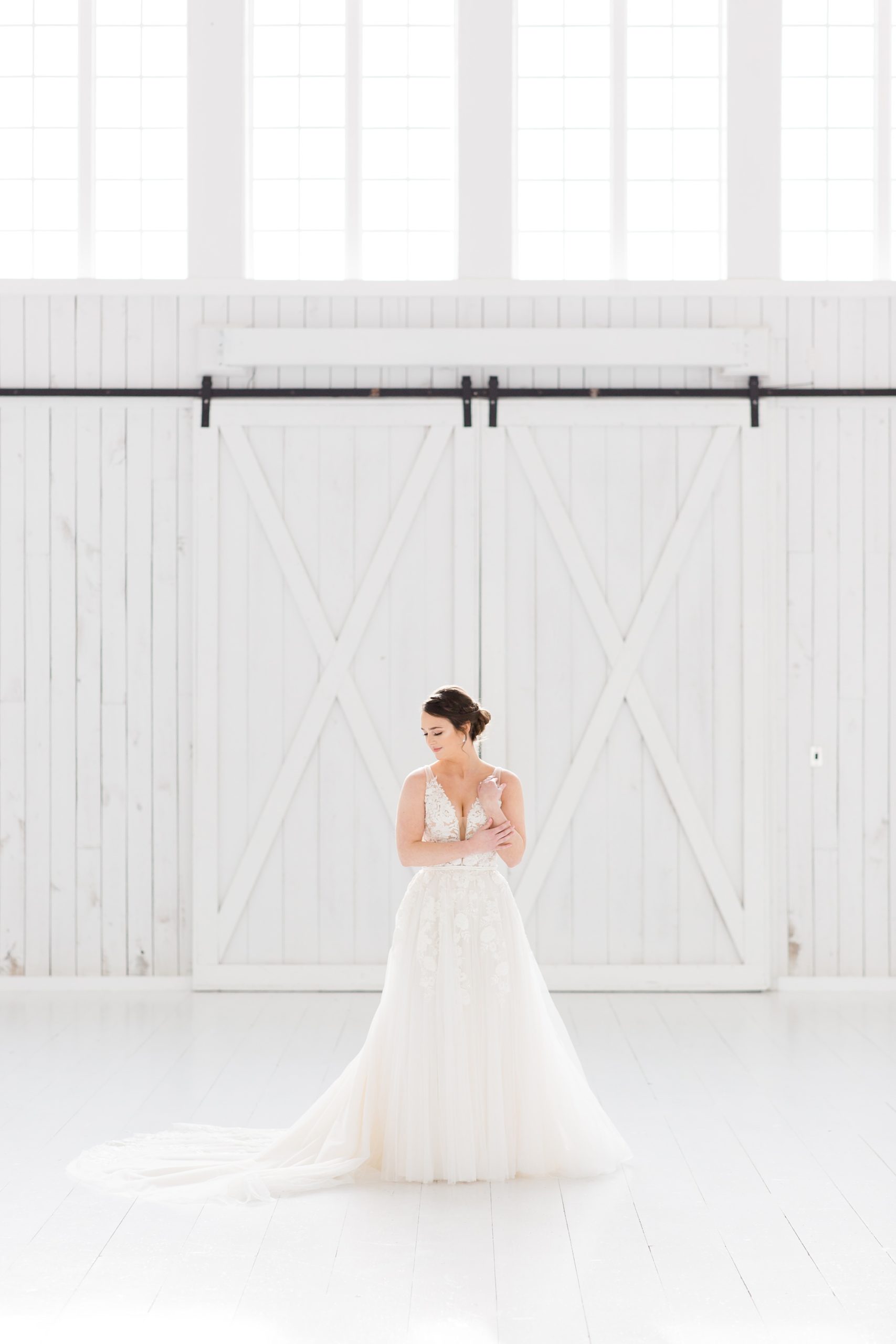 classic bridal portraits in front of barn door at the White Sparrow