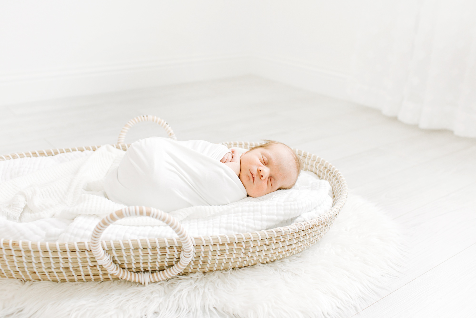 baby sleeps in basket during TX newborn session