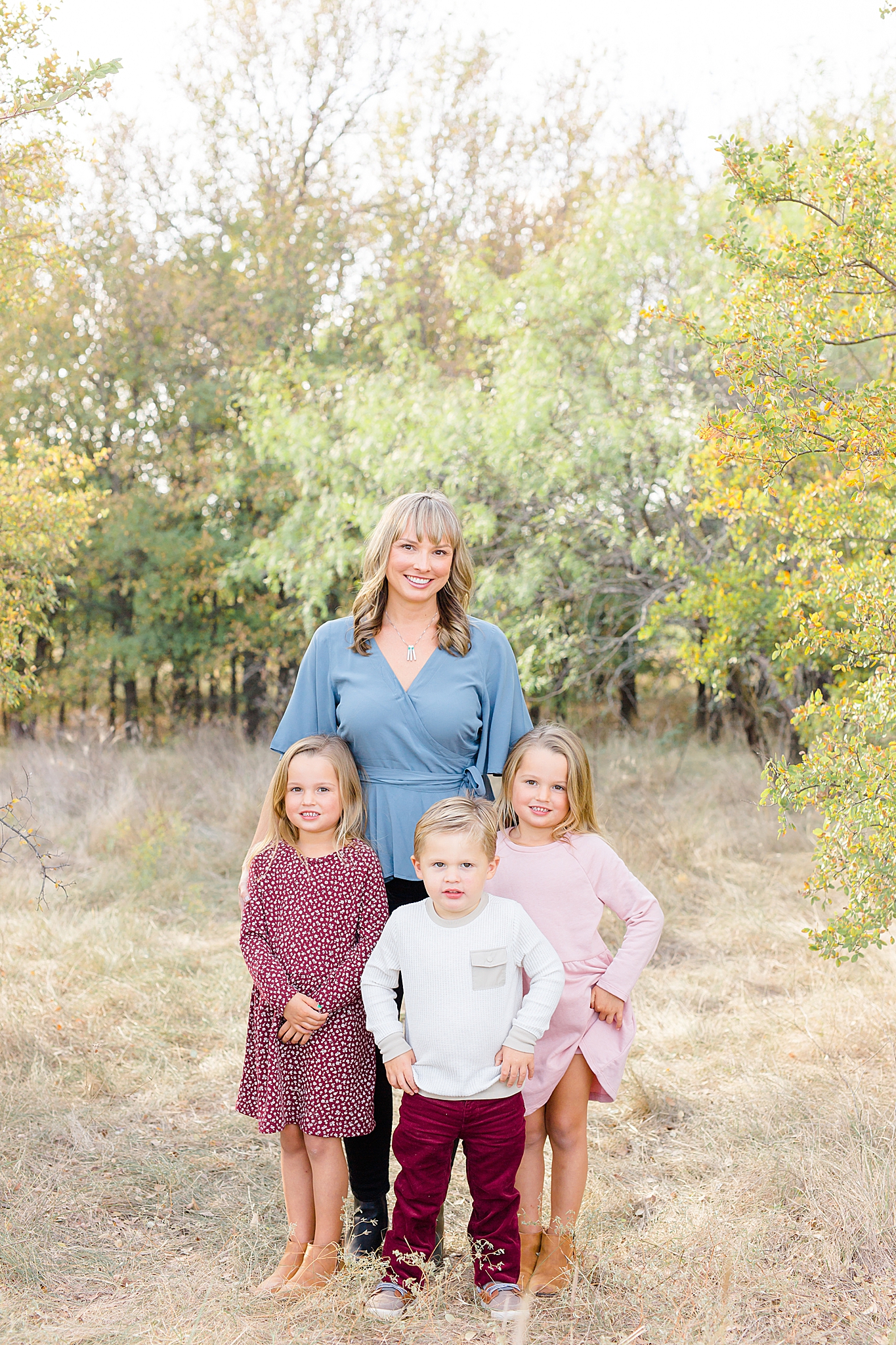 mom poses with three kids at Murrell Park