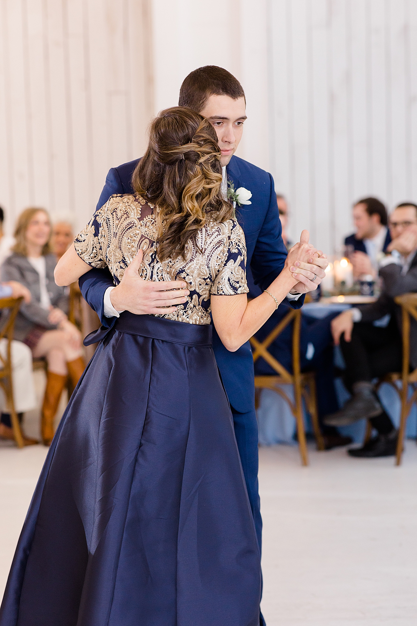 groom dances with mother during  Dallas TX wedding reception