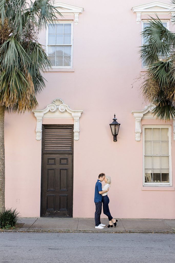 couple kisses by The Mills House in Charleston 