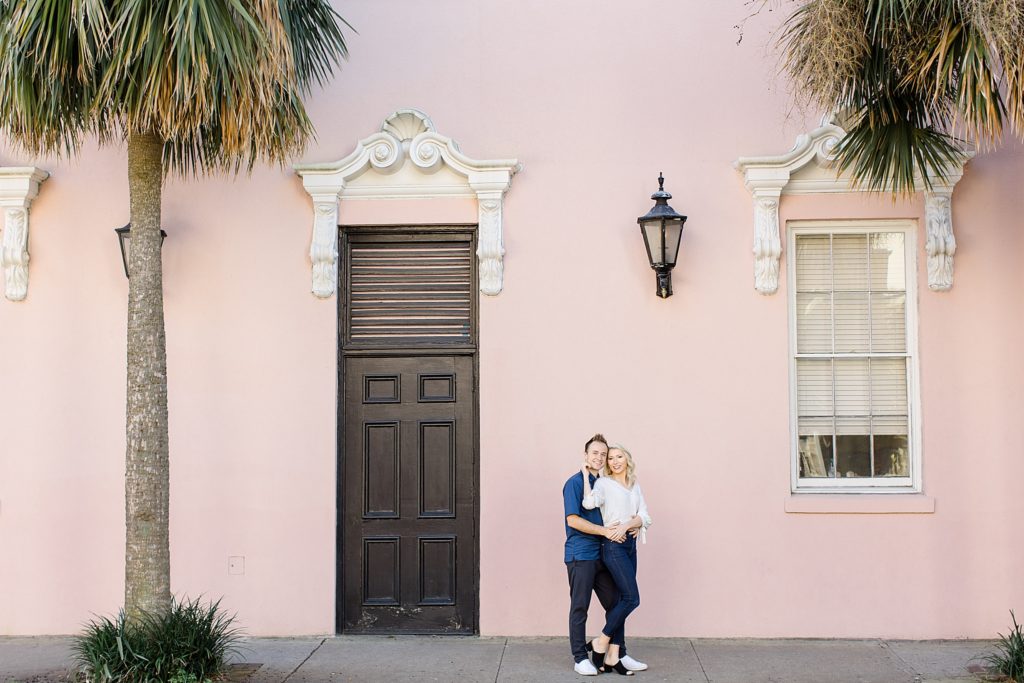 couple poses by The Mills House in Charleston SC