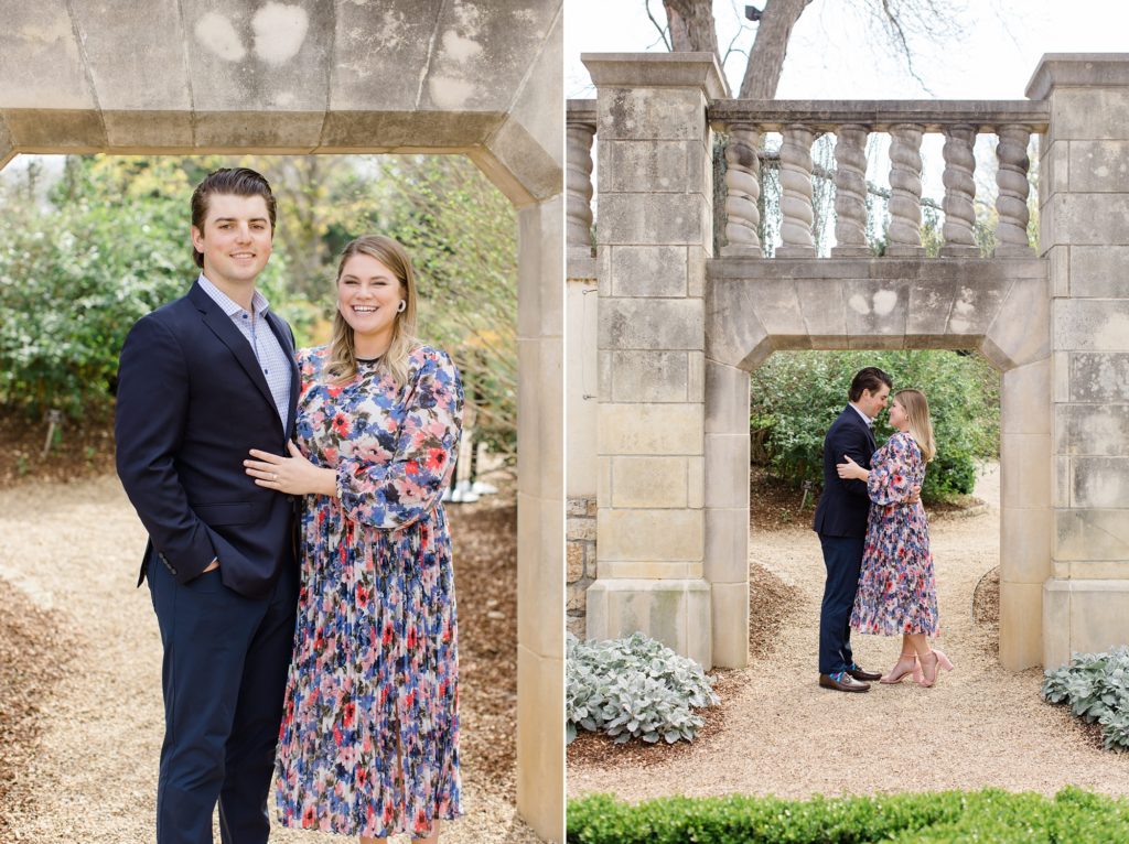 couple poses under stone bridge during Dallas Arboretum engagement photos