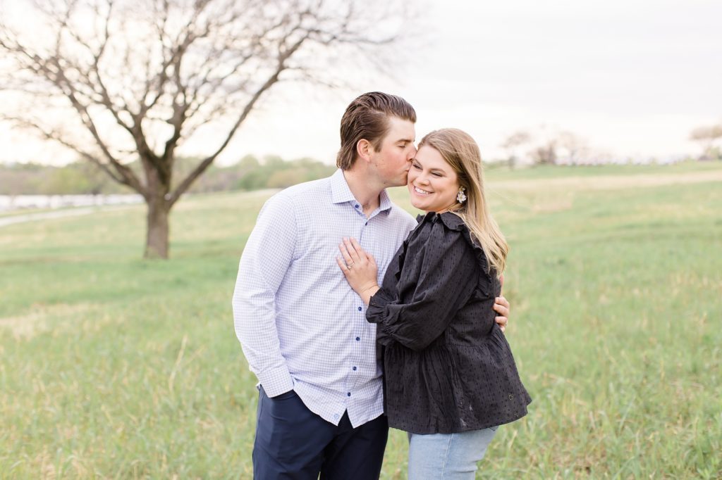 groom nuzzles bride's cheek during TX engagement session