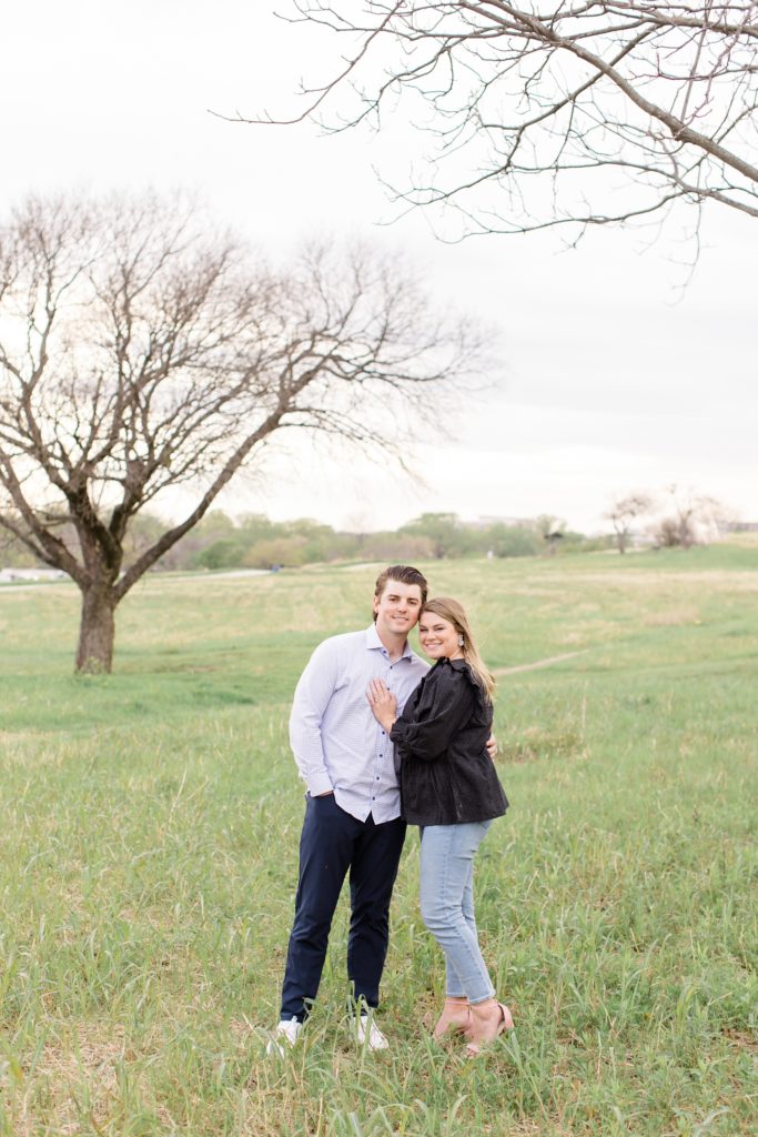 engagement portraits in the grass in Dallas TX