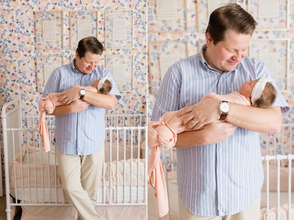 dad holds new baby girl during at home lifestyle newborn session