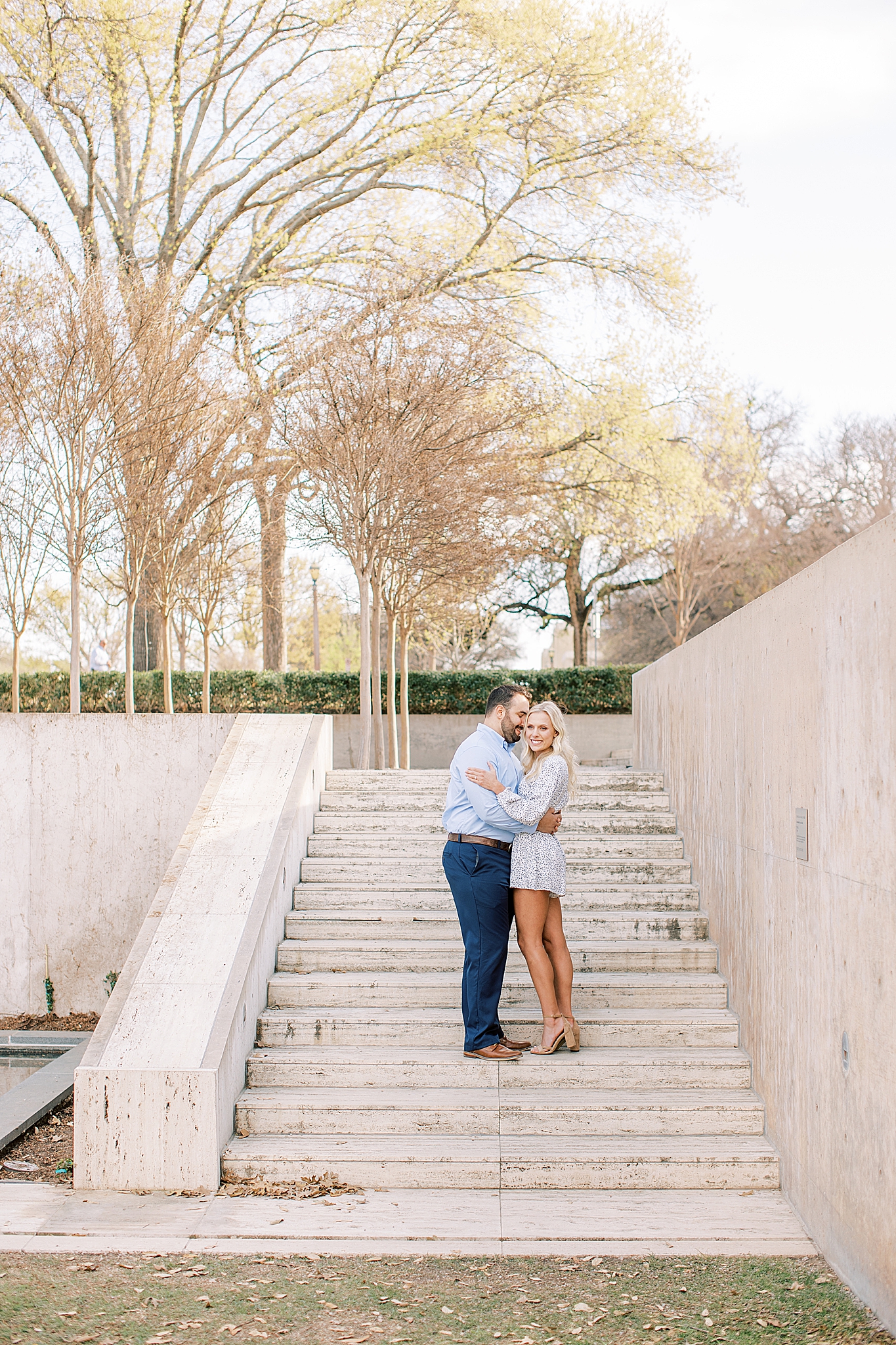 Texas couple poses together on steps at Kimball Art Museum