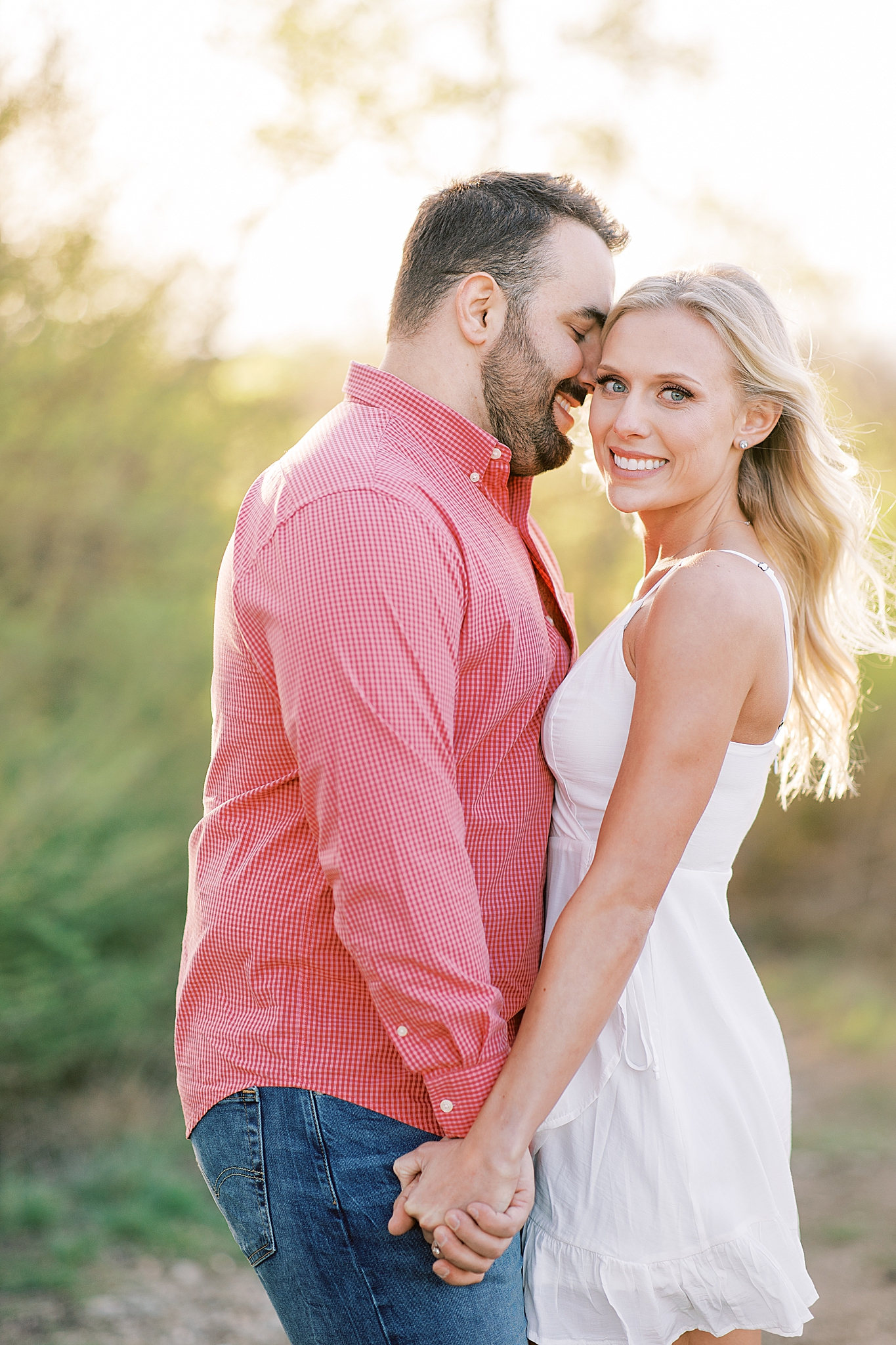 groom nuzzles bride's forehead during Tandy Hills engagement session