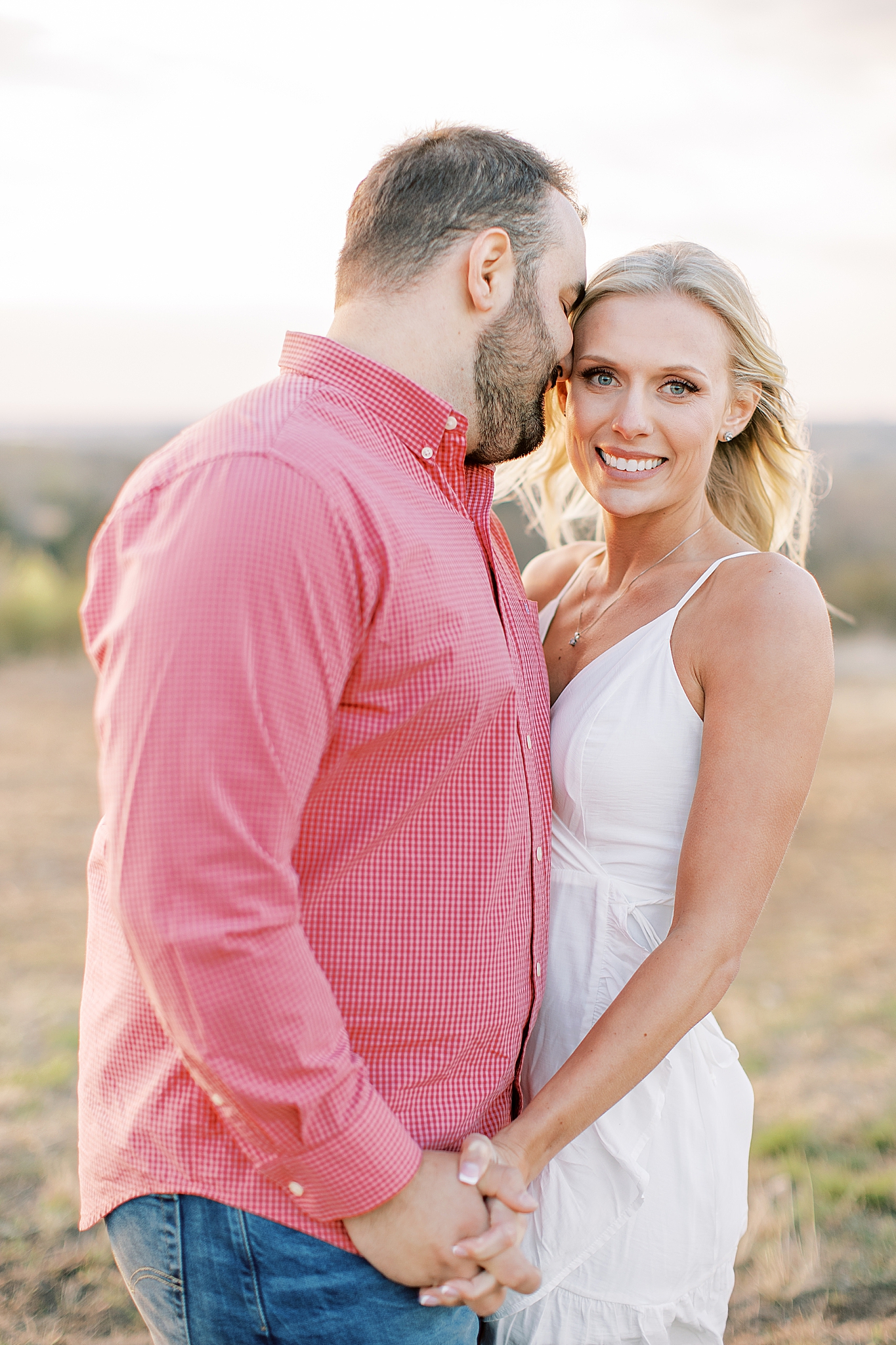 sunset engagement portraits in field in Fort Worth
