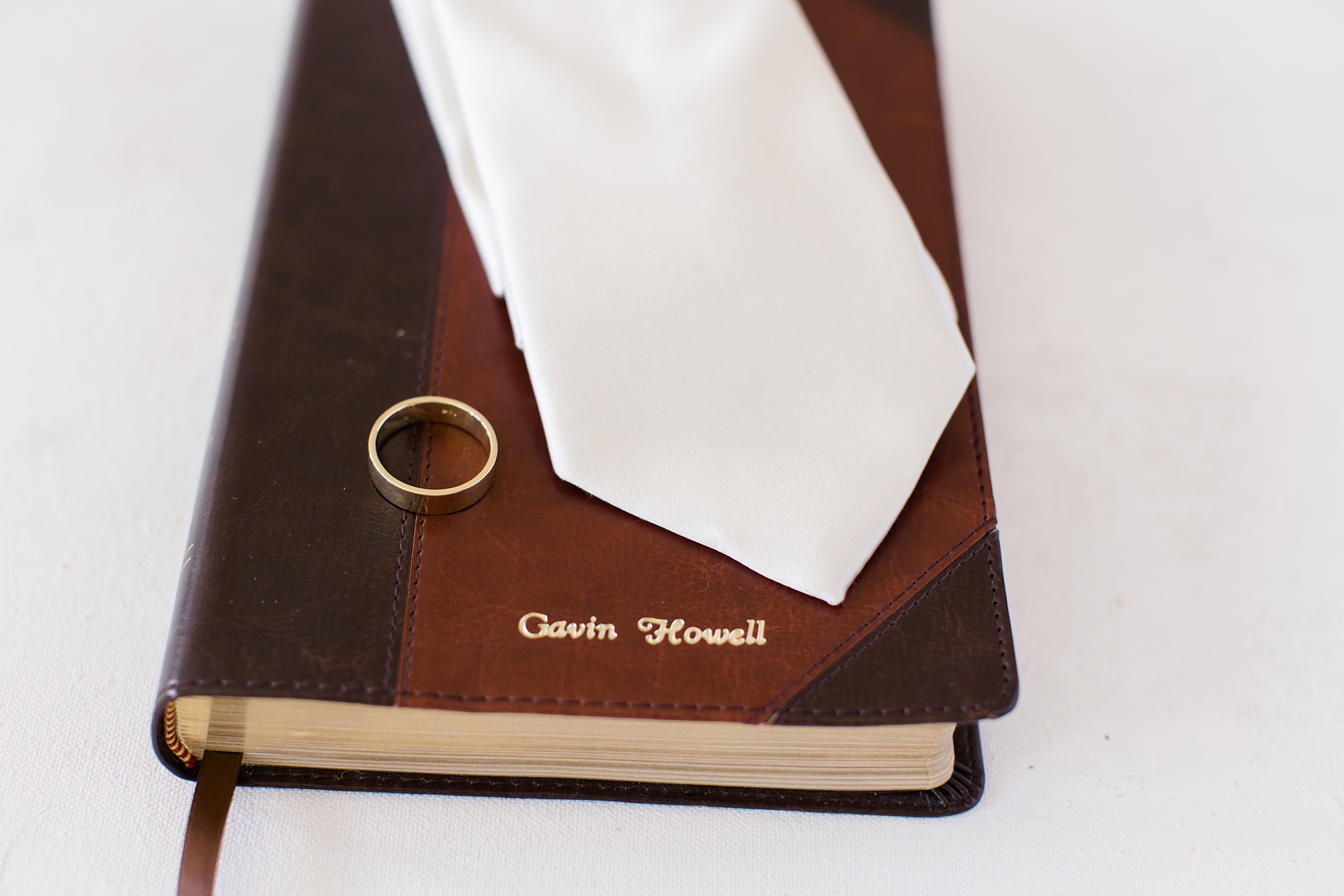 groom's details rest on bible 