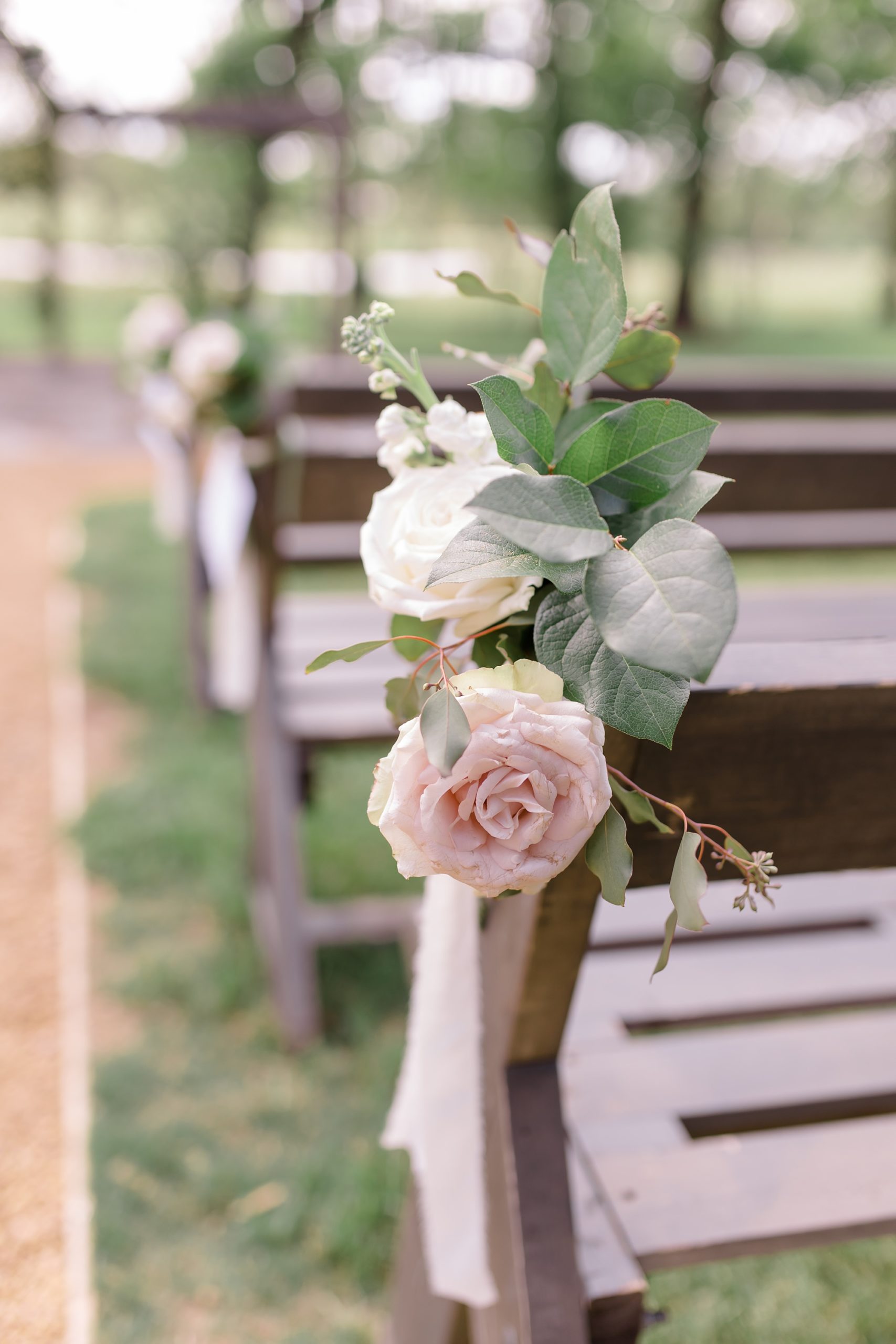 ceremony seating with pink roses on chair 