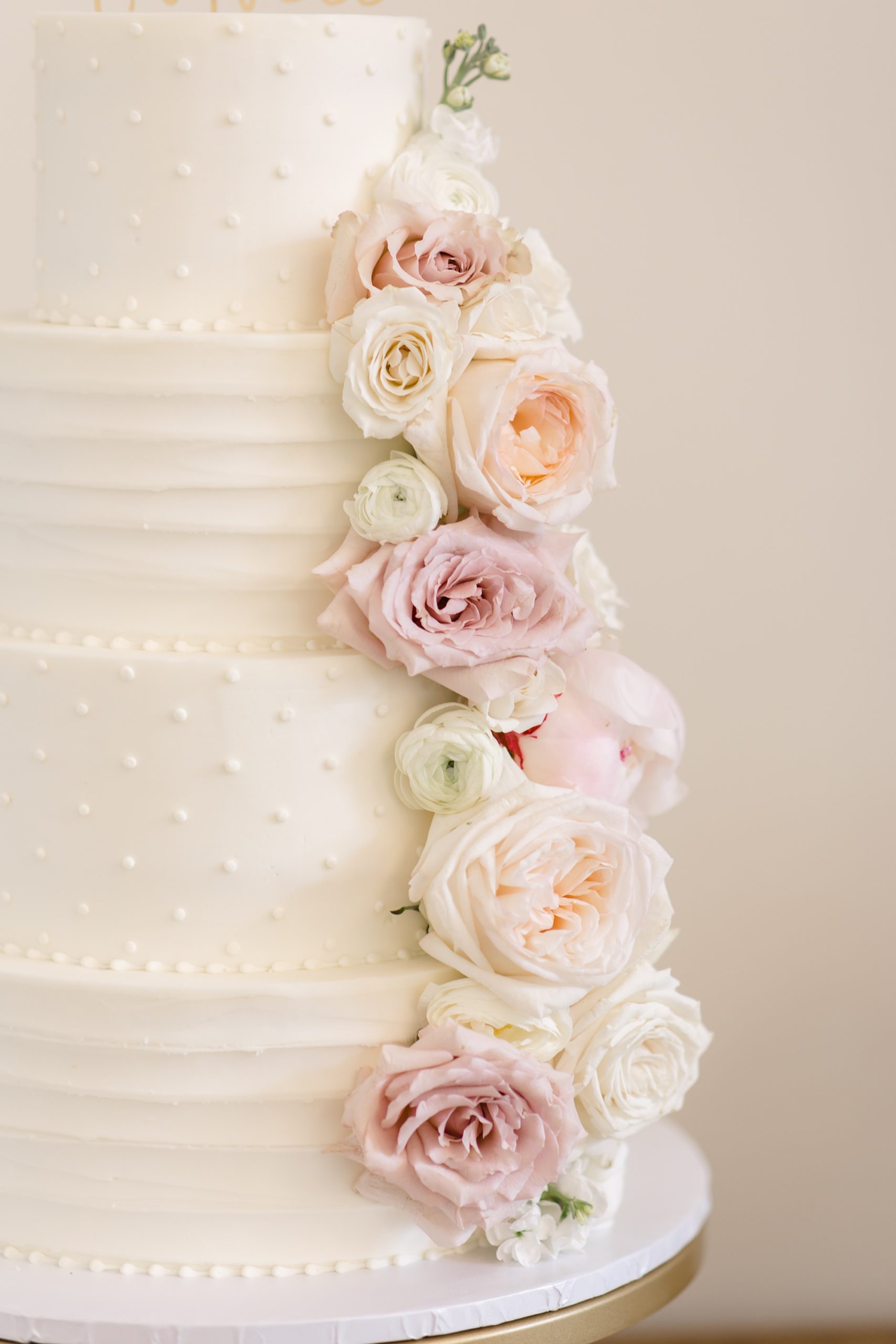 cake with pastel floral details at Oak + Ivy