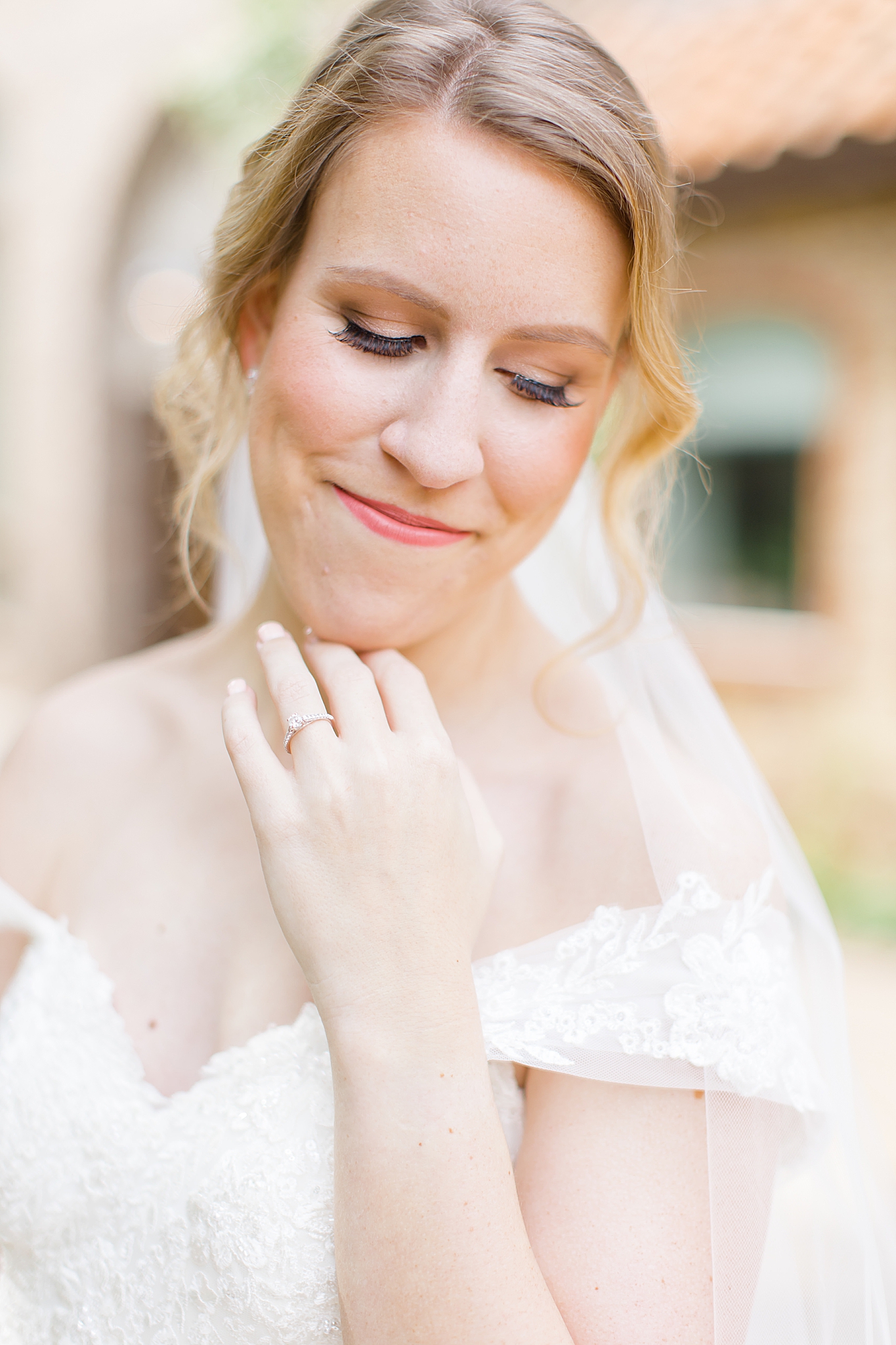 bride looks down at wedding ring during Aristide Mansfield bridal portraits 