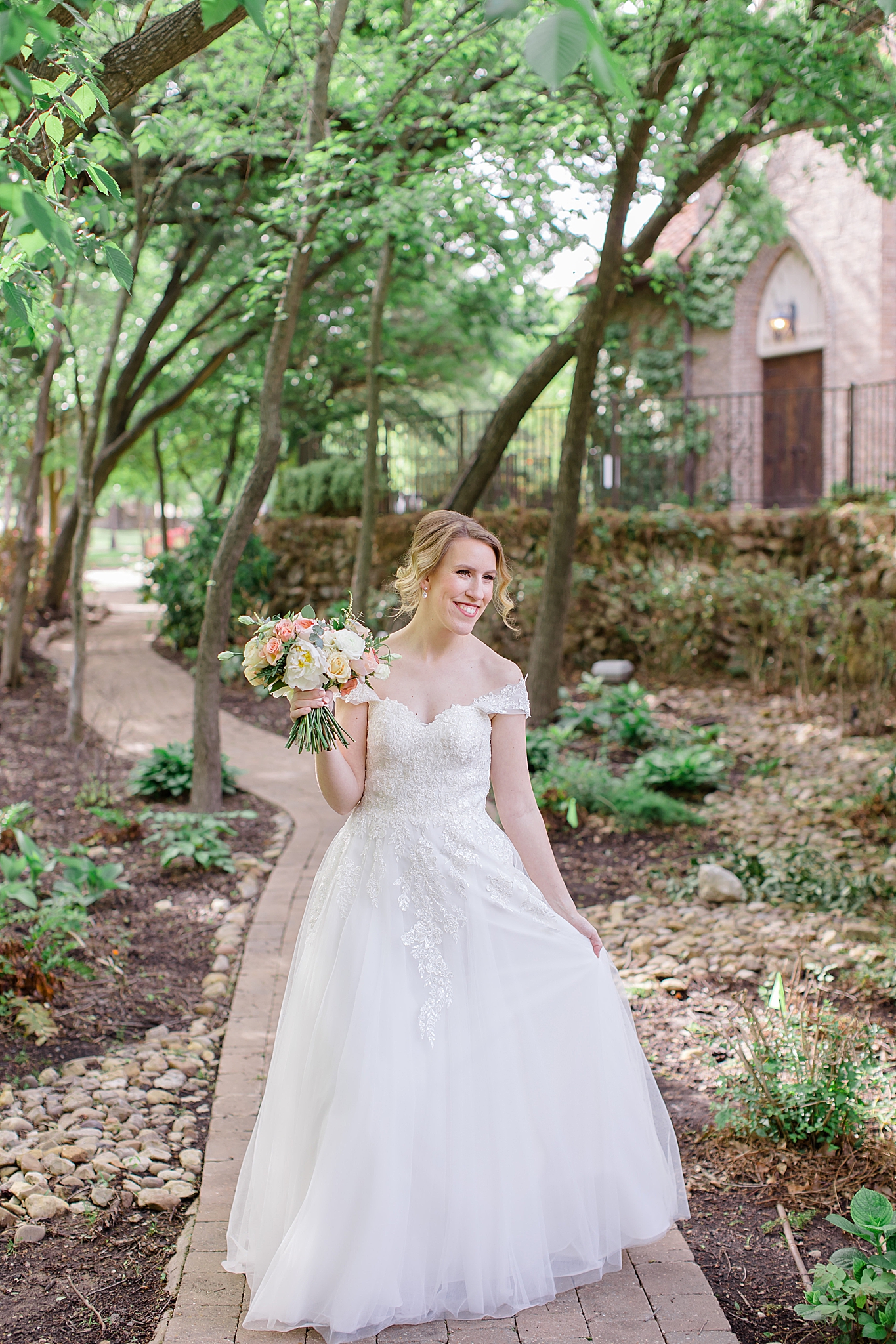 bride walks through garden in Texas venue