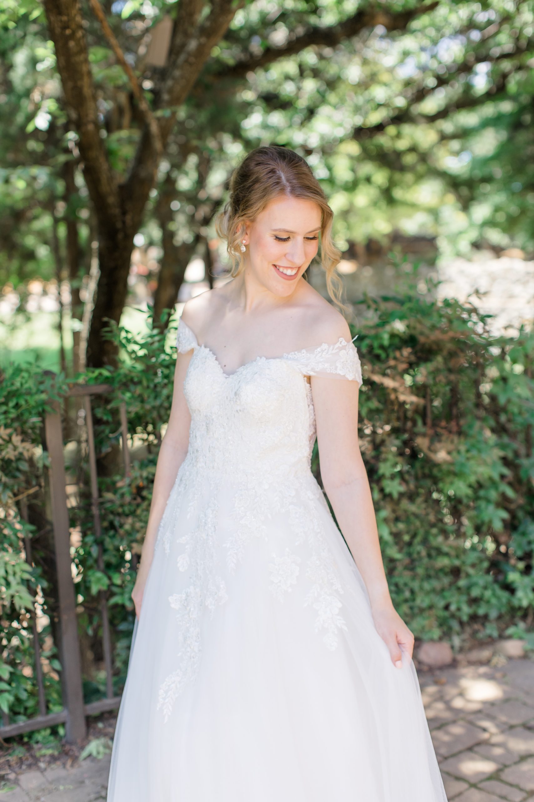 bride twirls wedding dress slowly during TX bridal portraits