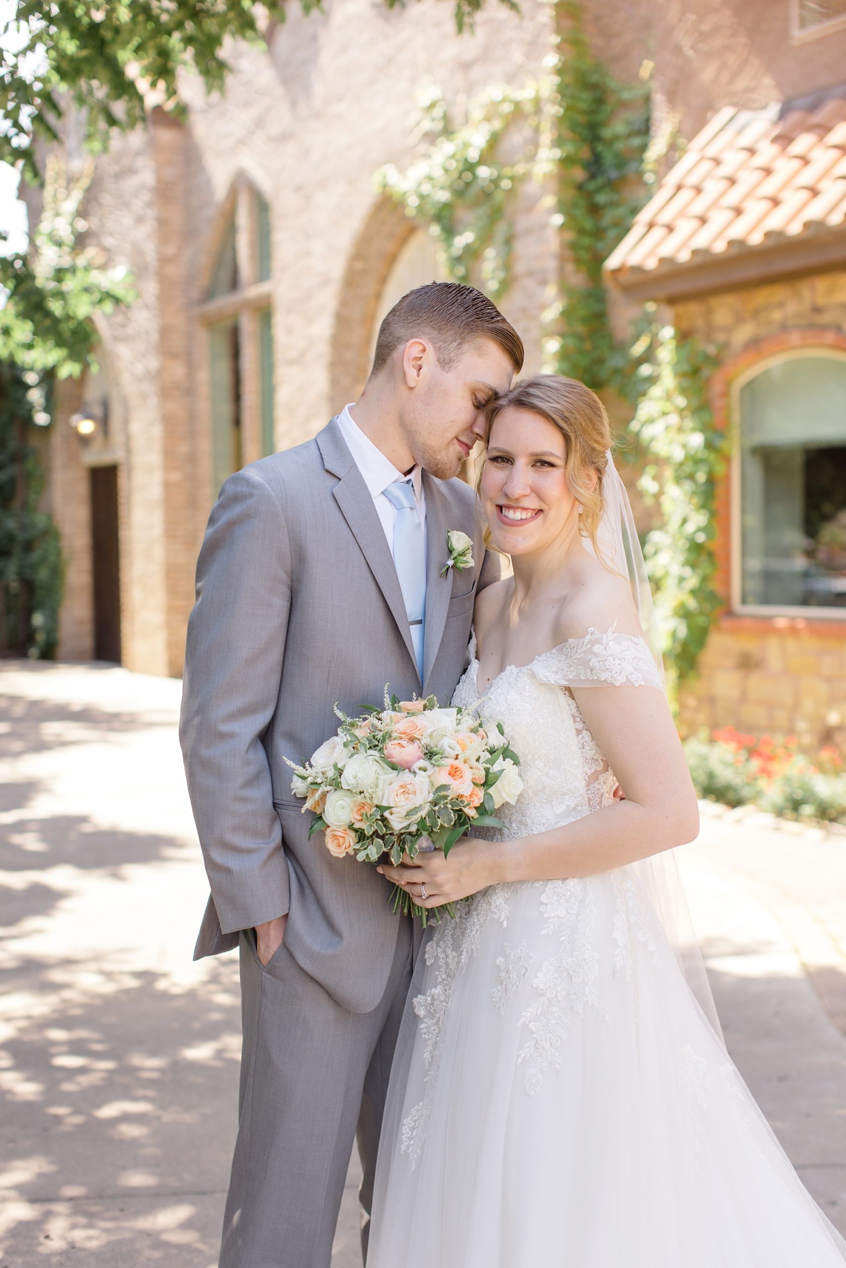 groom nuzzles bride's forehead during TX wedding photos